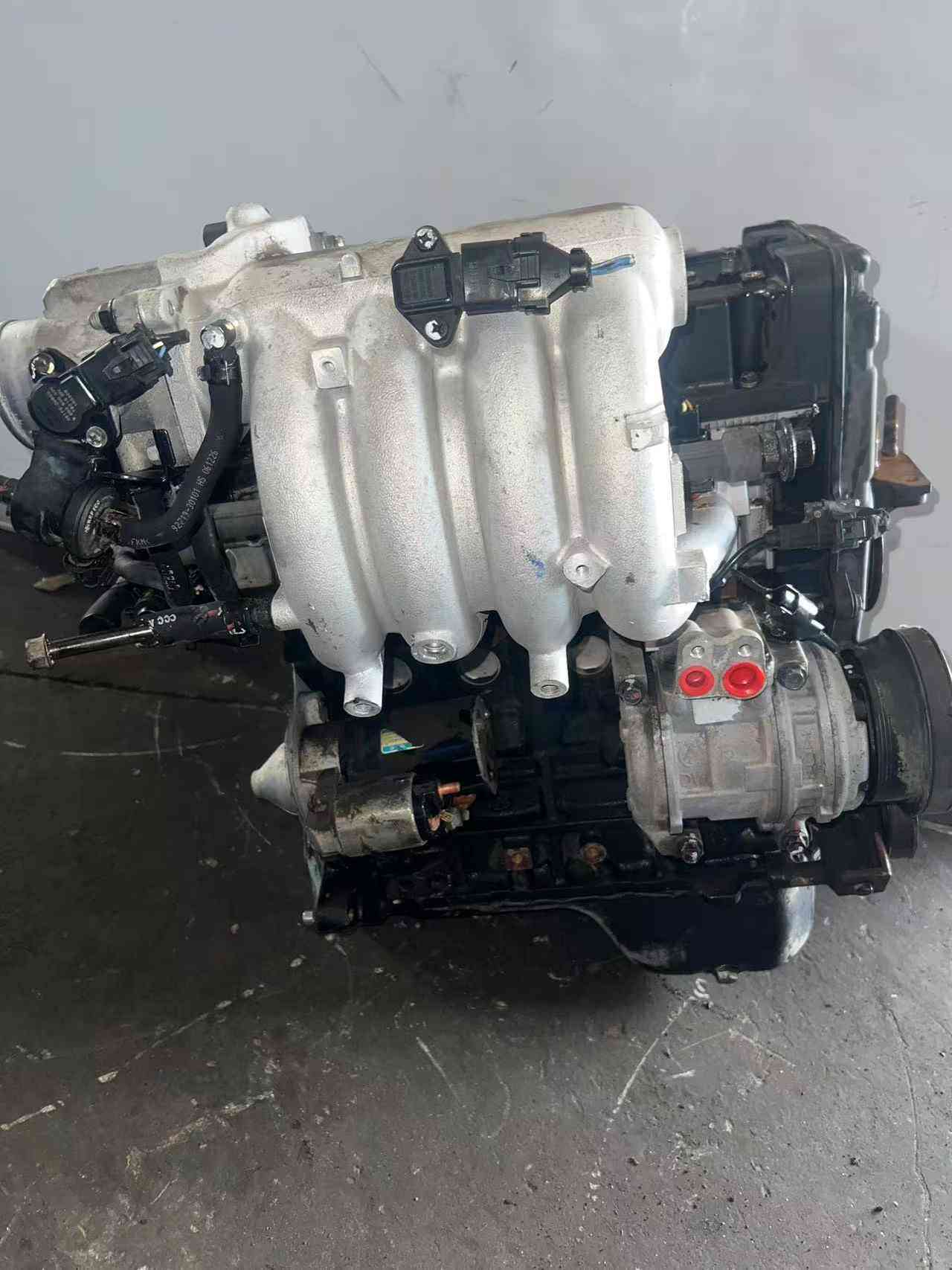 Hyundai G4ED engine side view with original accessories