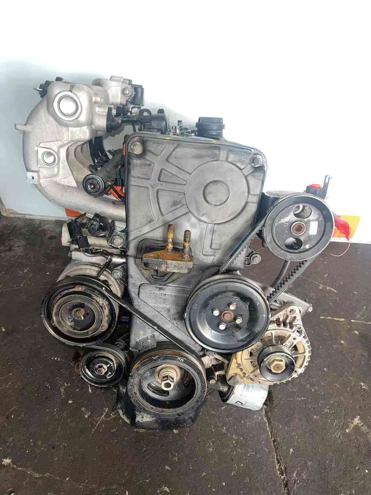 Real stock photo of used Hyundai G4ED engine assembly