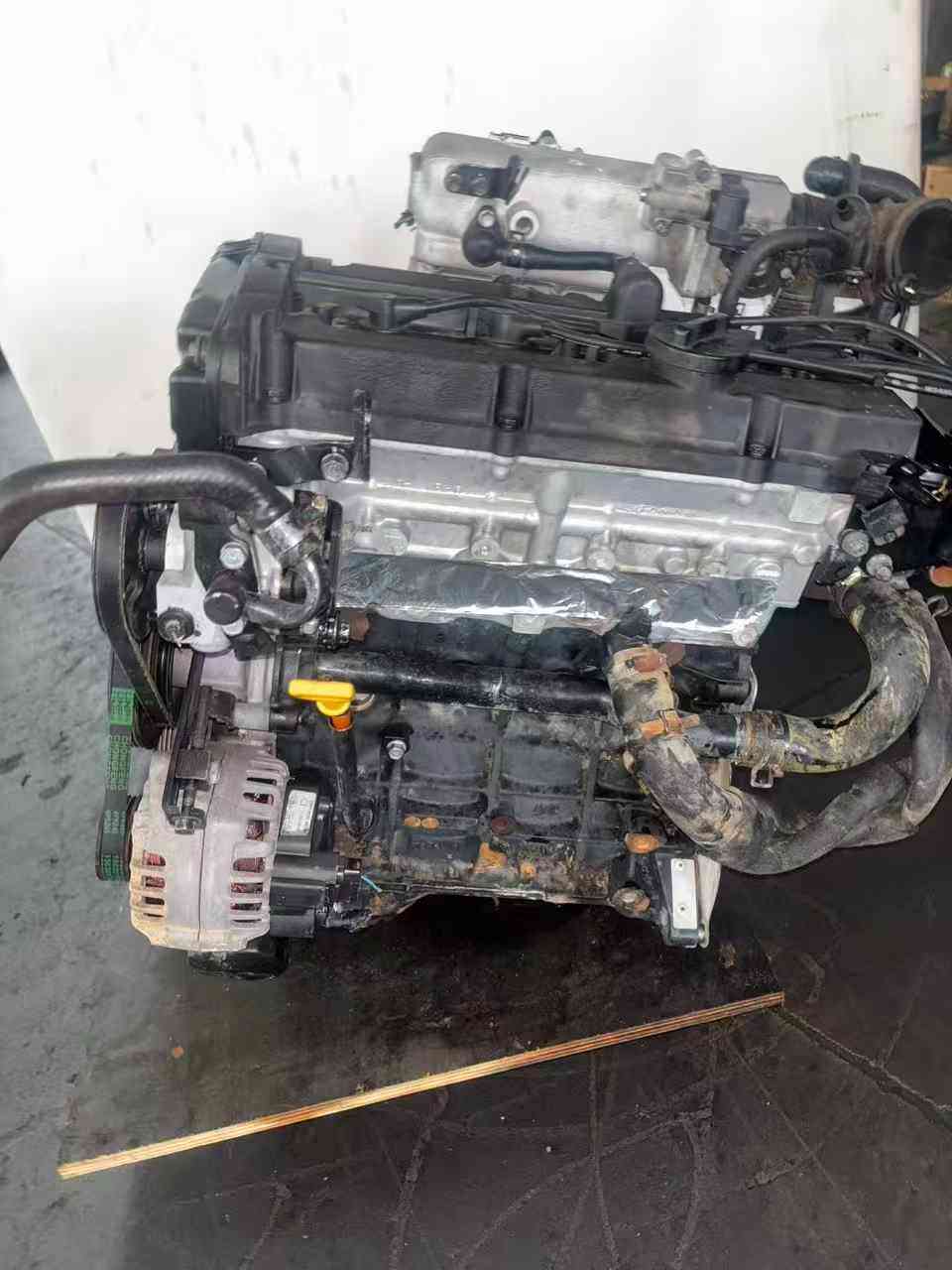 Real stock photo of used Hyundai G4EE engine assembly