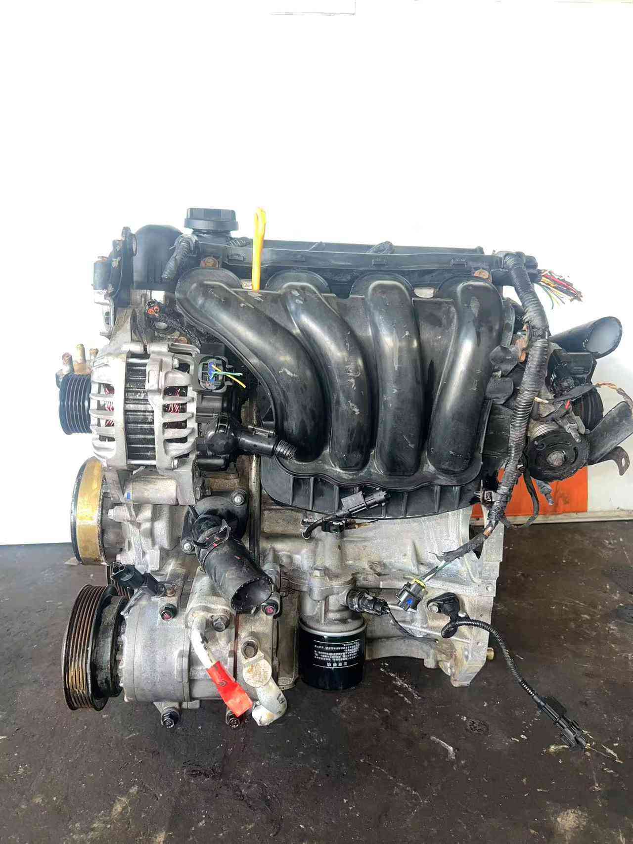 Real stock photo of used Hyundai G4FA engine assembly