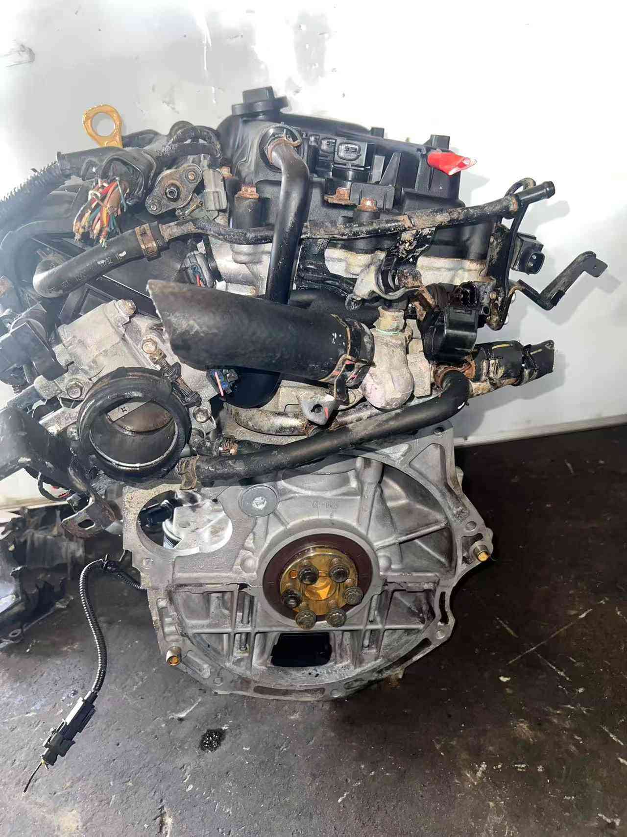 Hyundai G4FA engine side view with original accessories