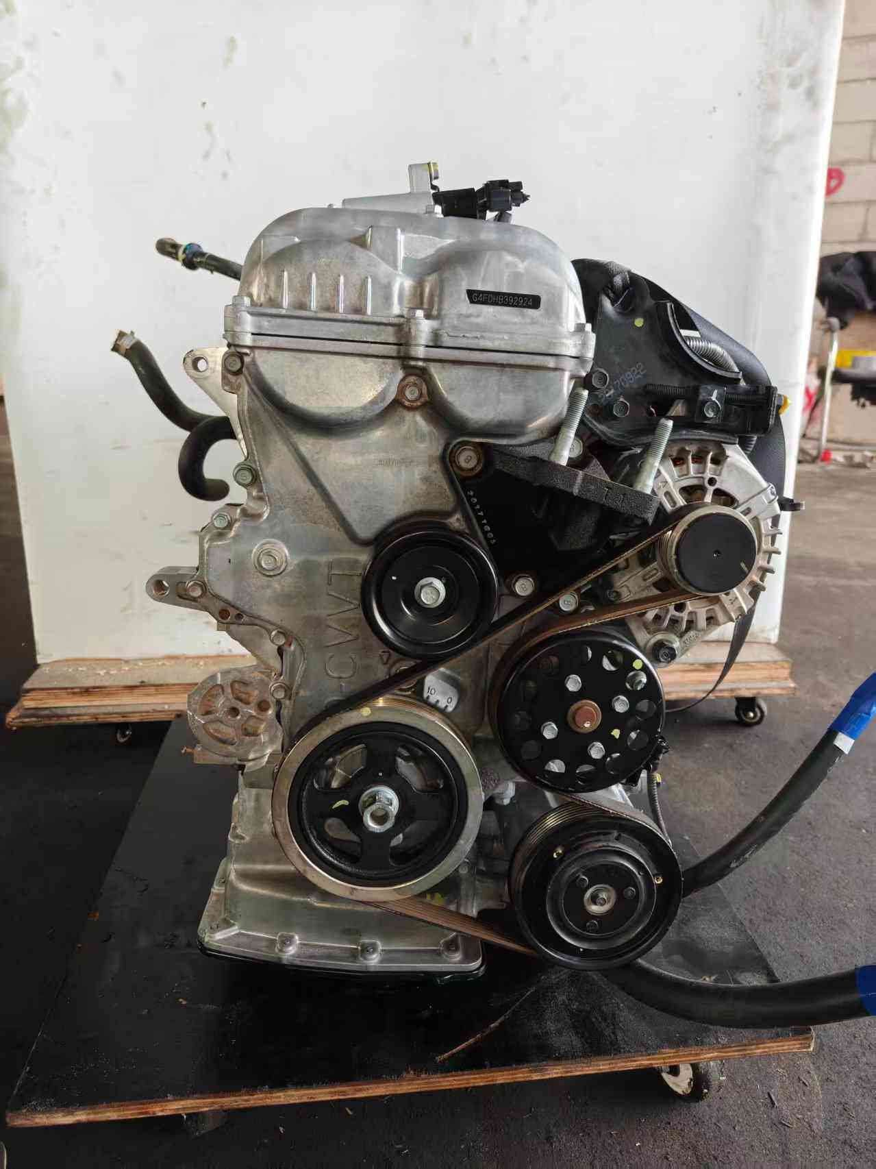 Real stock photo of used Hyundai G4FD engine assembly