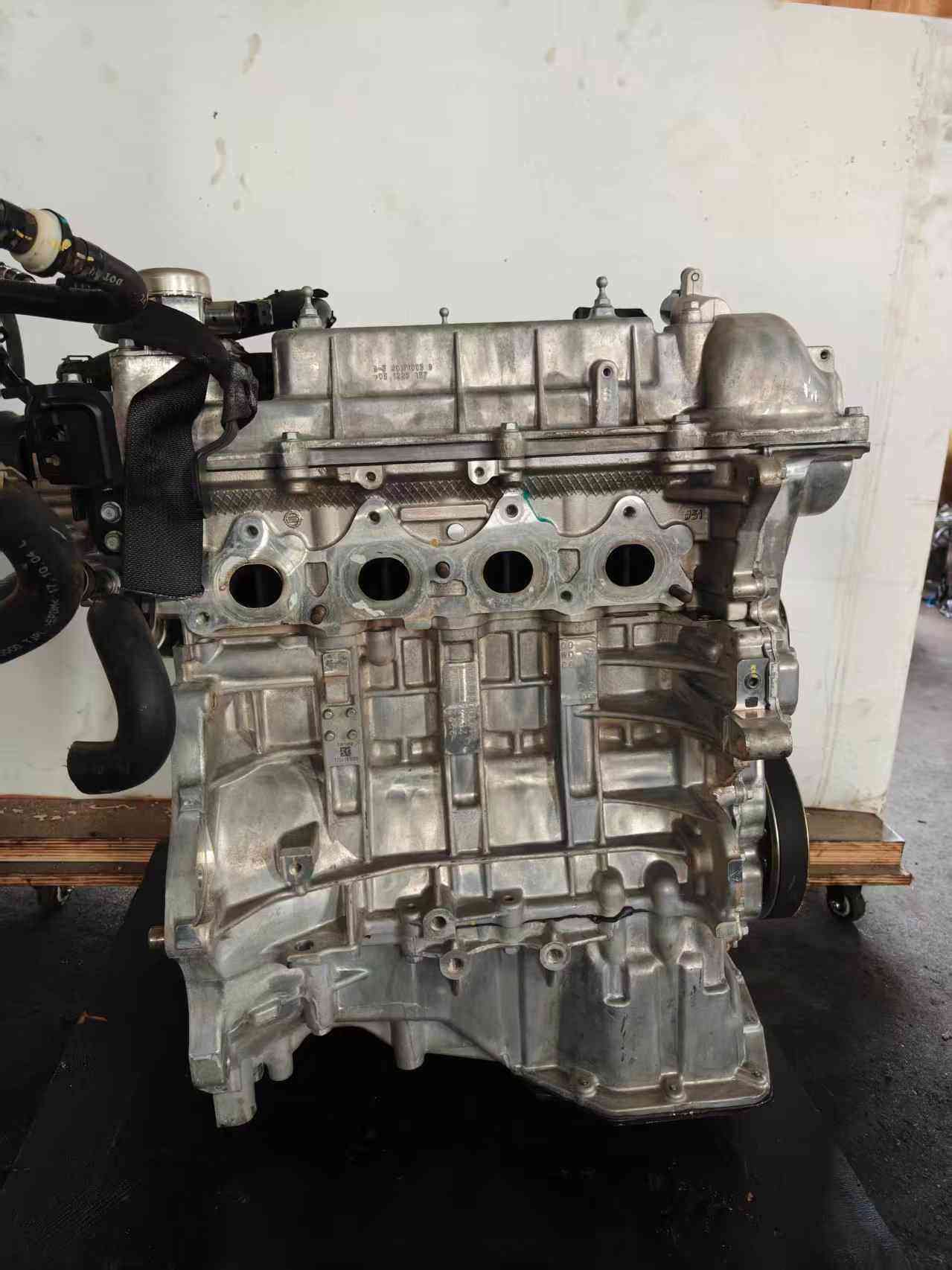 Hyundai G4FD engine side view with original components