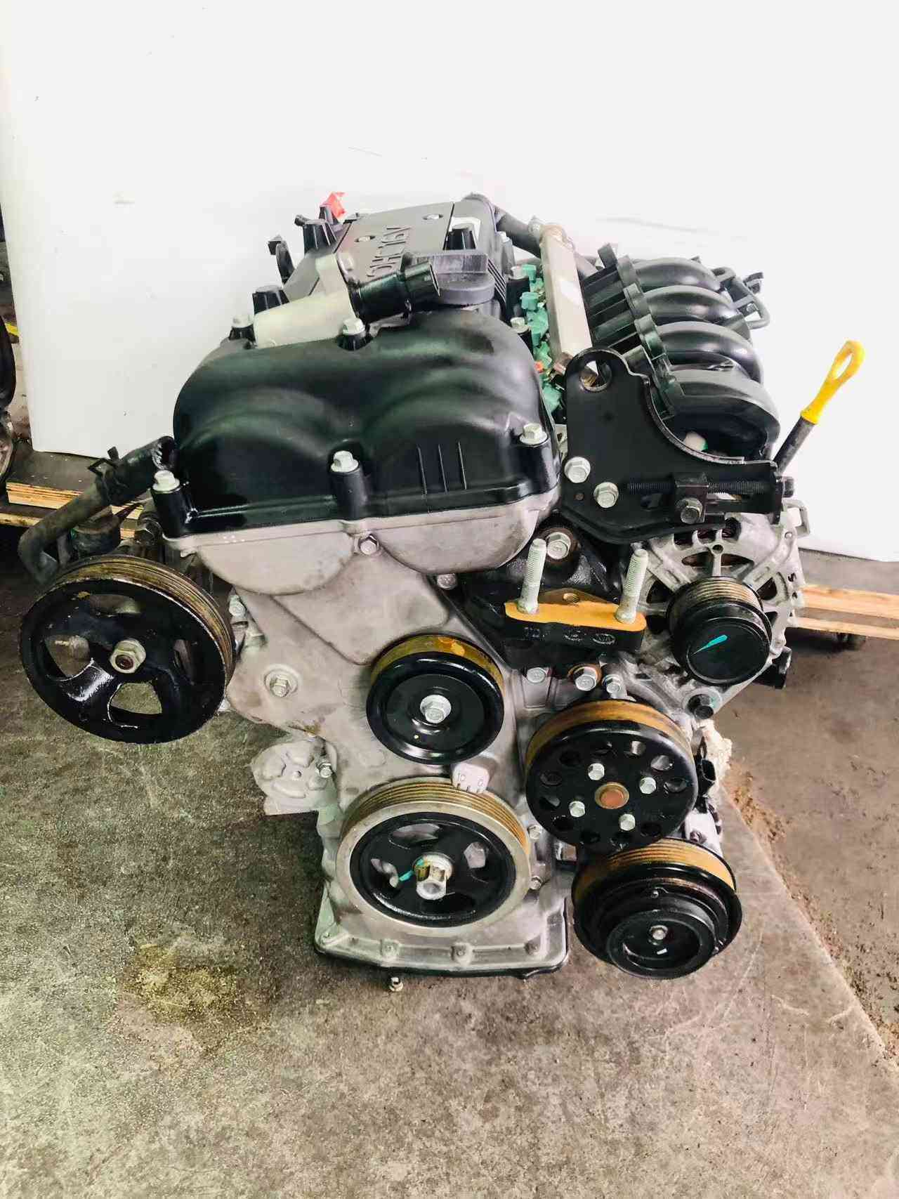Hyundai G4FG engine side view with original accessories