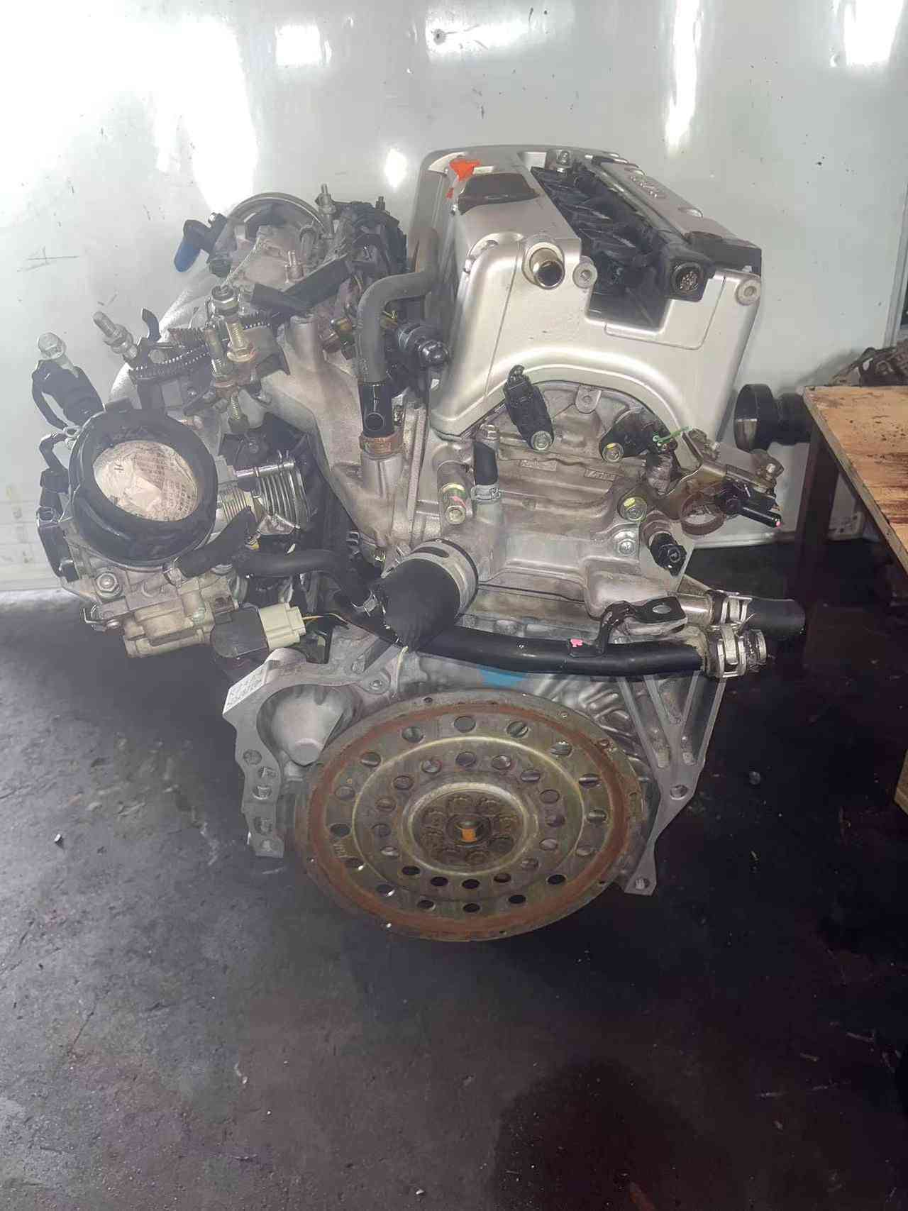 K24A engine transmission side with flywheel