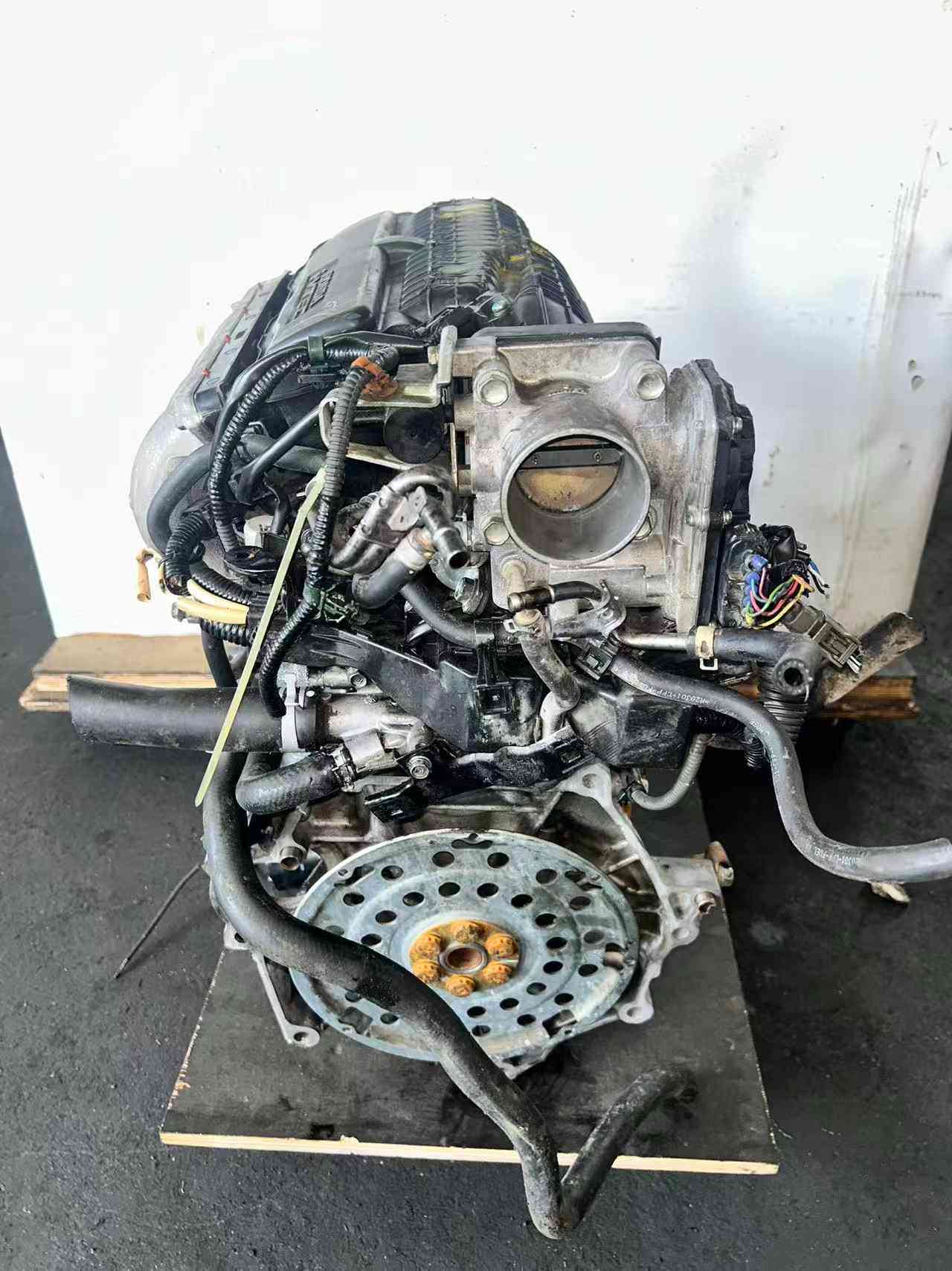 L15A engine transmission side with flywheel