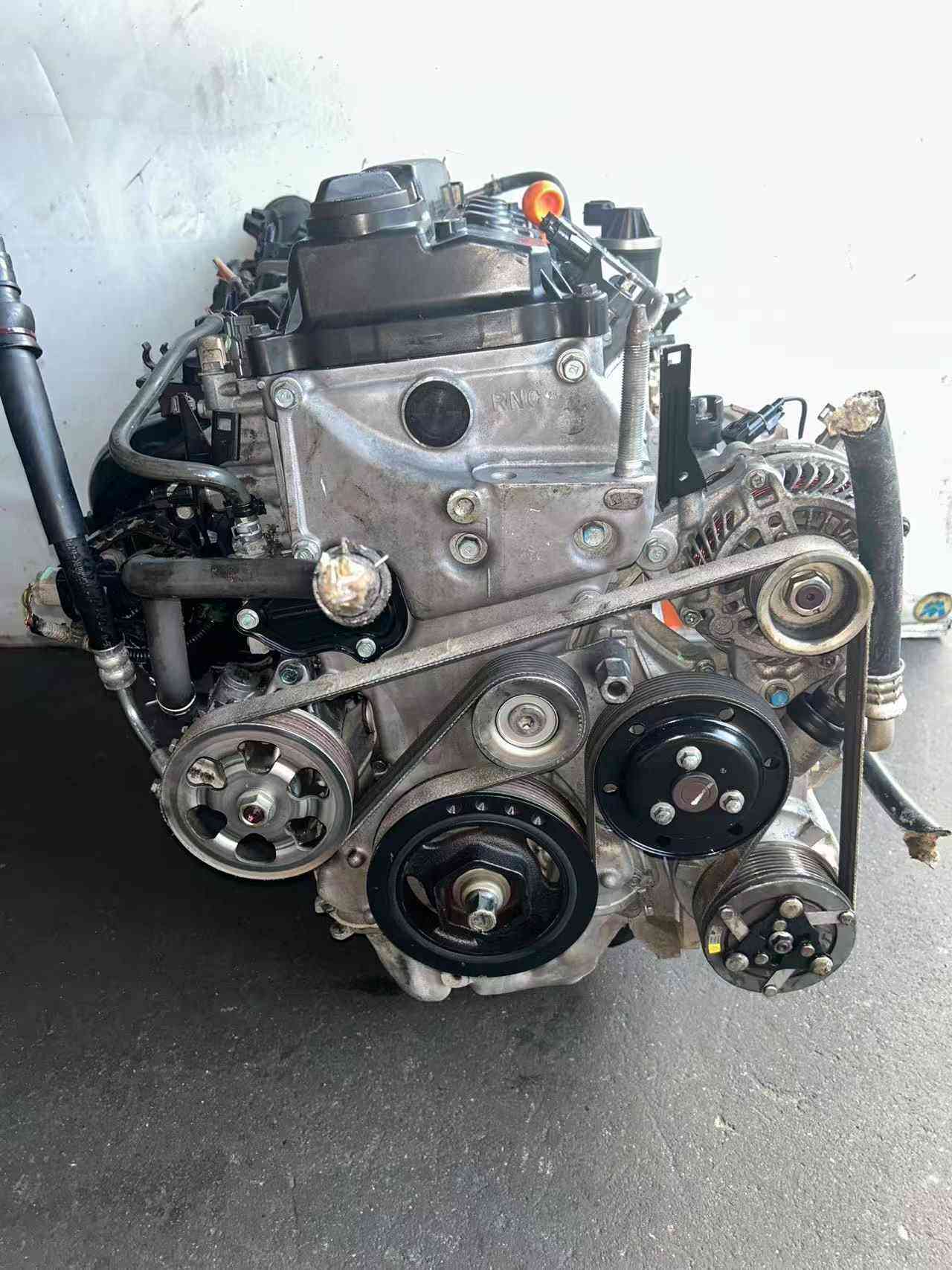 R18A1 engine assembly with alternator and drive belt