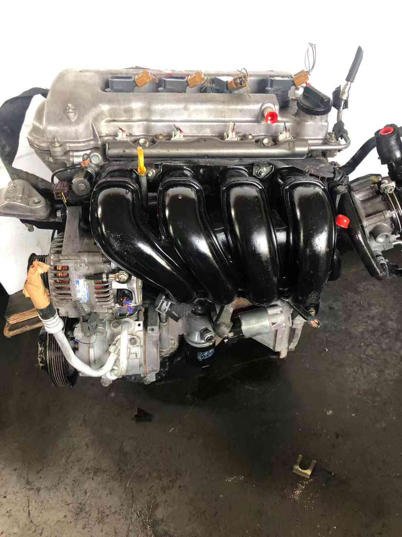 Toyota 1ZZ-FE engine side view with original accessories
