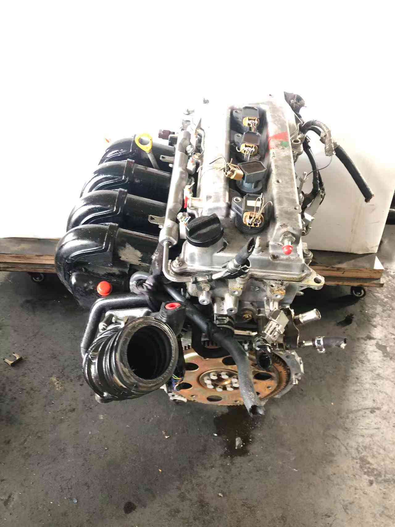 Real stock photo of used Toyota 1ZZ-FE engine assembly