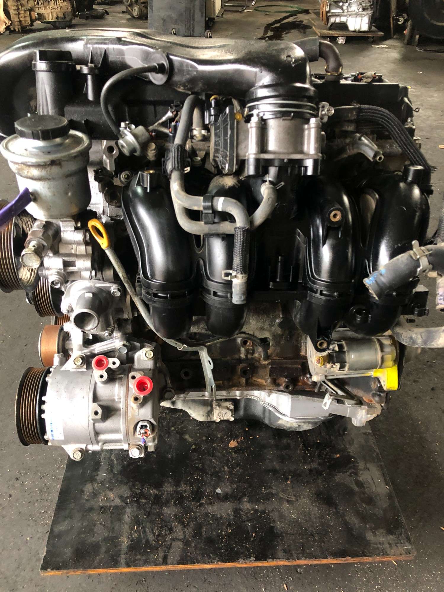 Real stock photo of used Toyota 2TR-FE engine assembly
