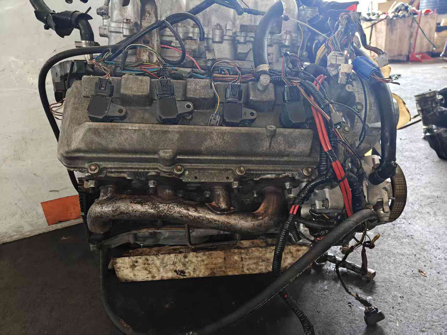 Real stock photo of used Toyota 2UZ-FE engine assembly