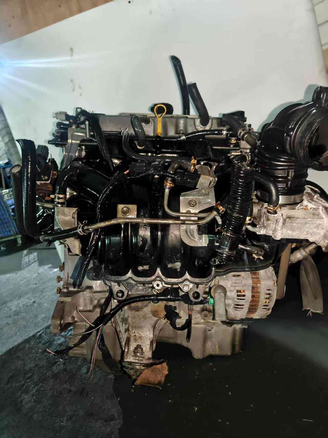 Used replacement engine motor identified as Chery SQRE4T15C