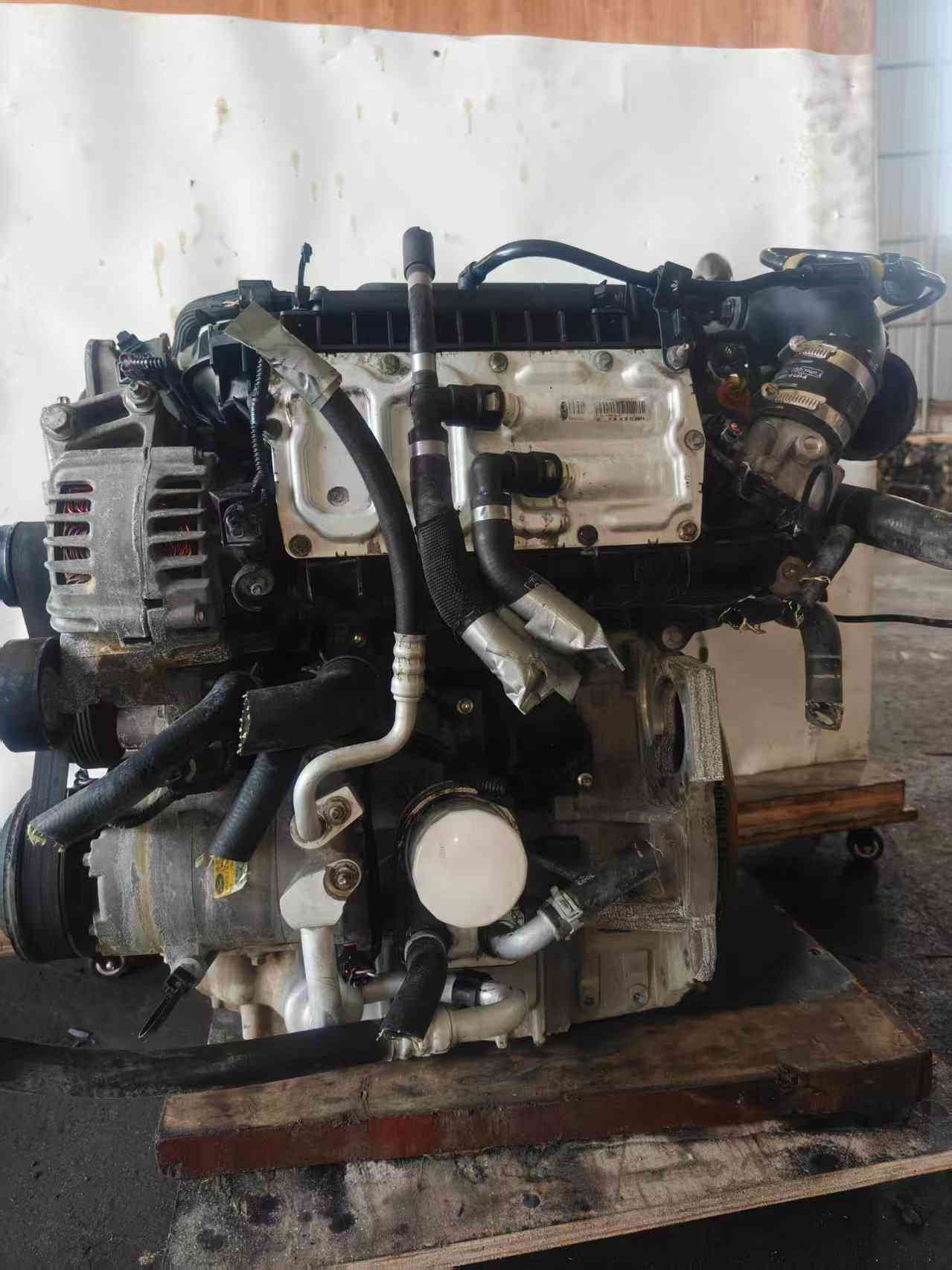 Ford 1.5 EcoBoost engine intake manifold side with alternator and AC compressor