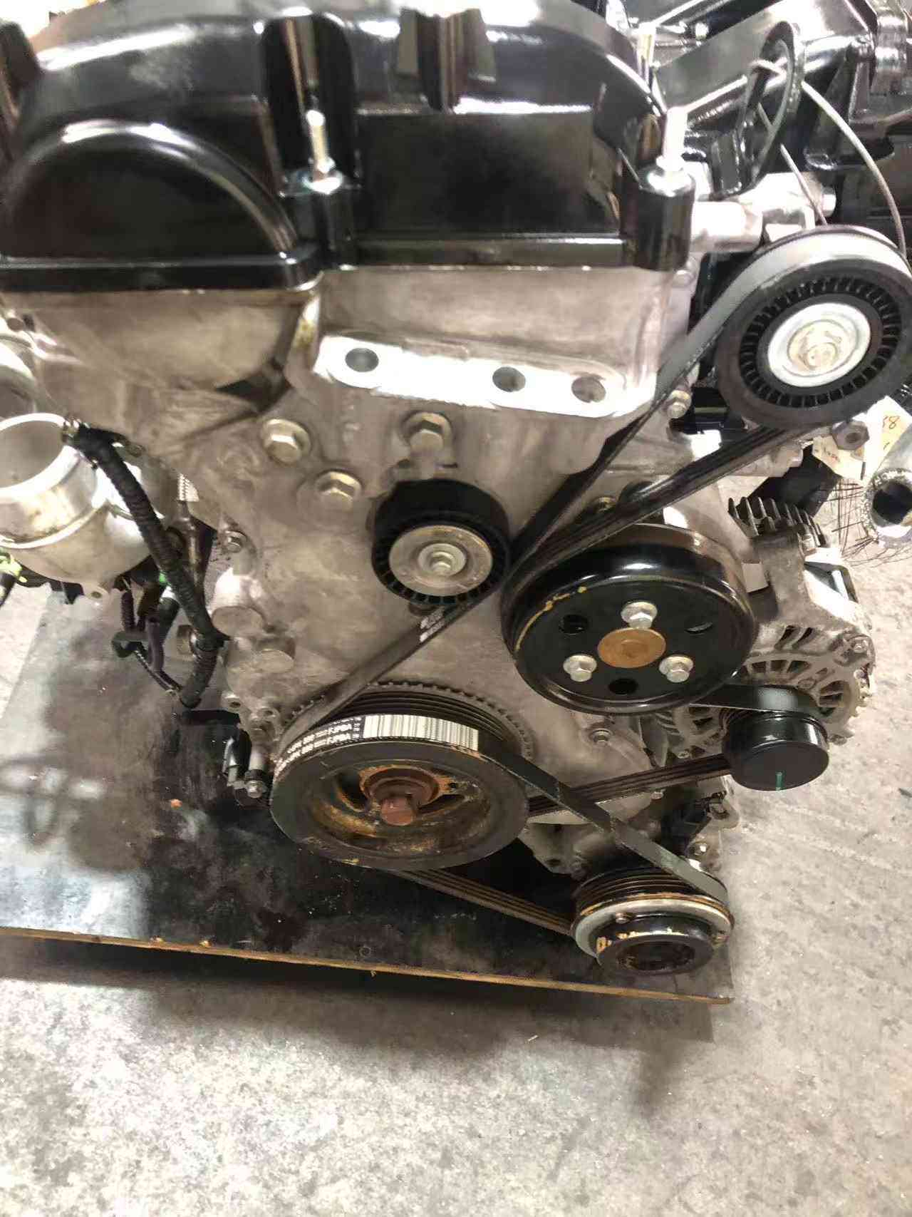 Ford 2.0 EcoBoost engine front view with timing cover and belt pulleys
