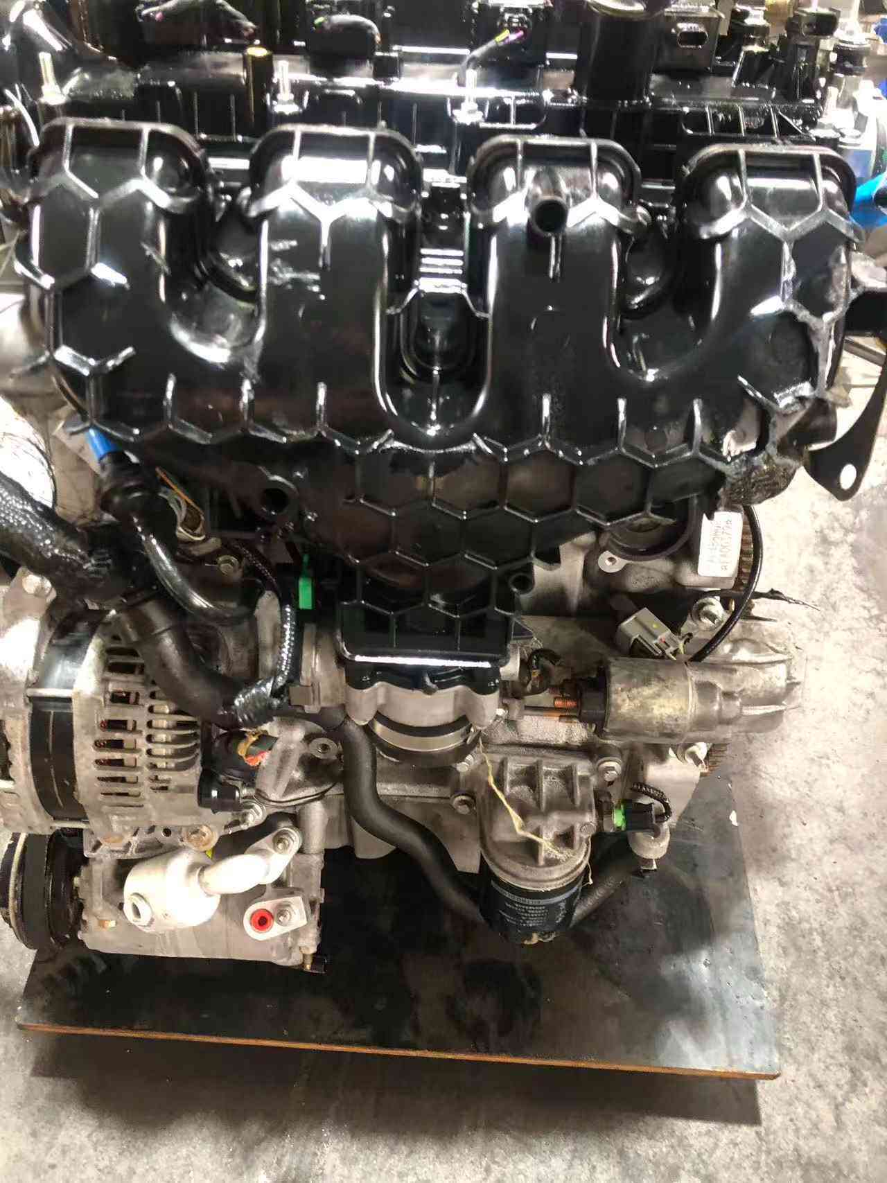 Ford 2.0 EcoBoost engine intake manifold side with throttle body and starter