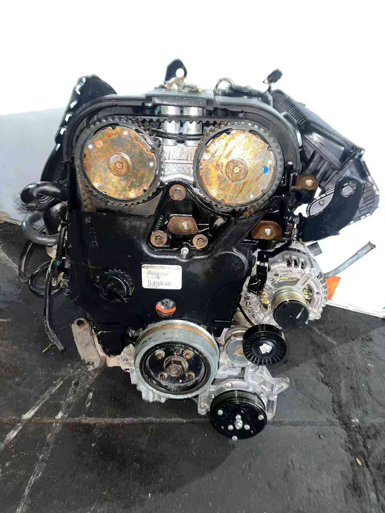 Ford 2.5 EcoBoost engine front view with exposed camshaft gears and timing belt