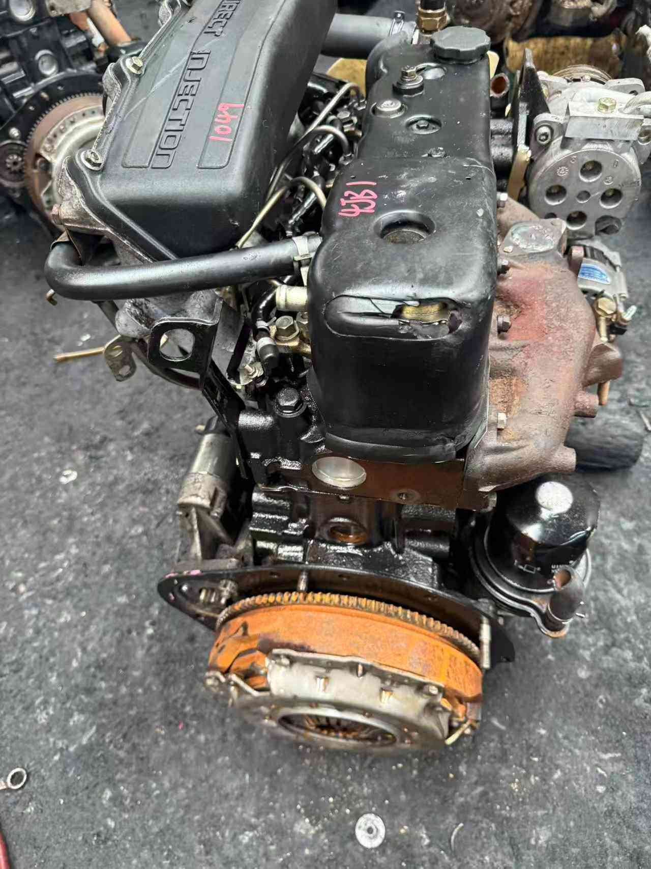 Isuzu 4JB1 engine angle view with clutch flywheel assembly and intake manifold