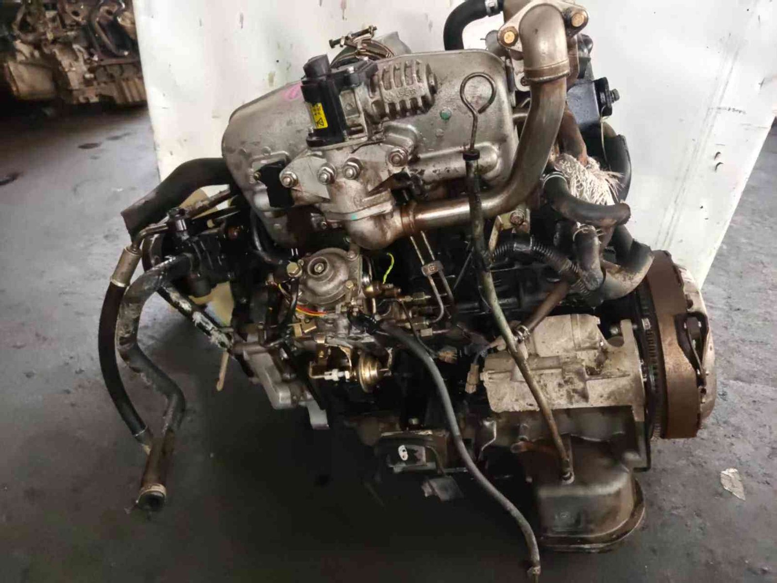 Isuzu 4JB1T engine angle view with EGR valve, intake manifold and fuel pump
