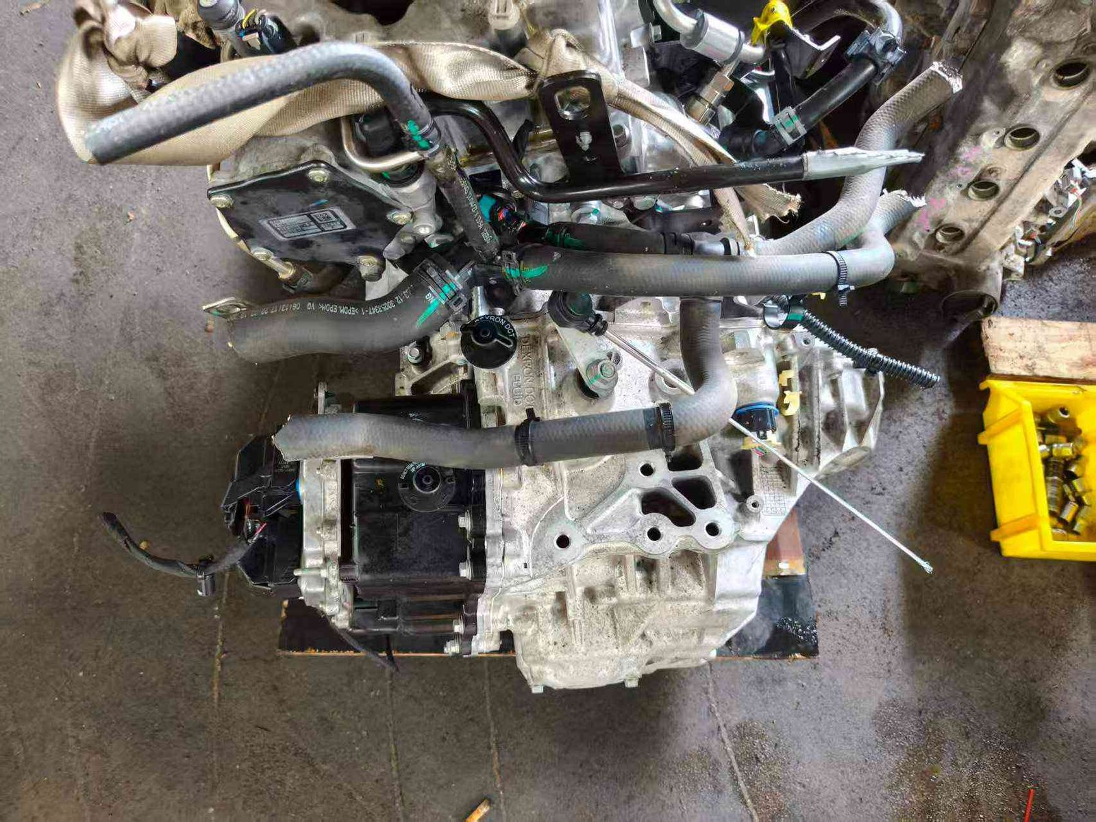 Close-up of the ECU mounting and electrical connectors on a 15E4E engine unit.