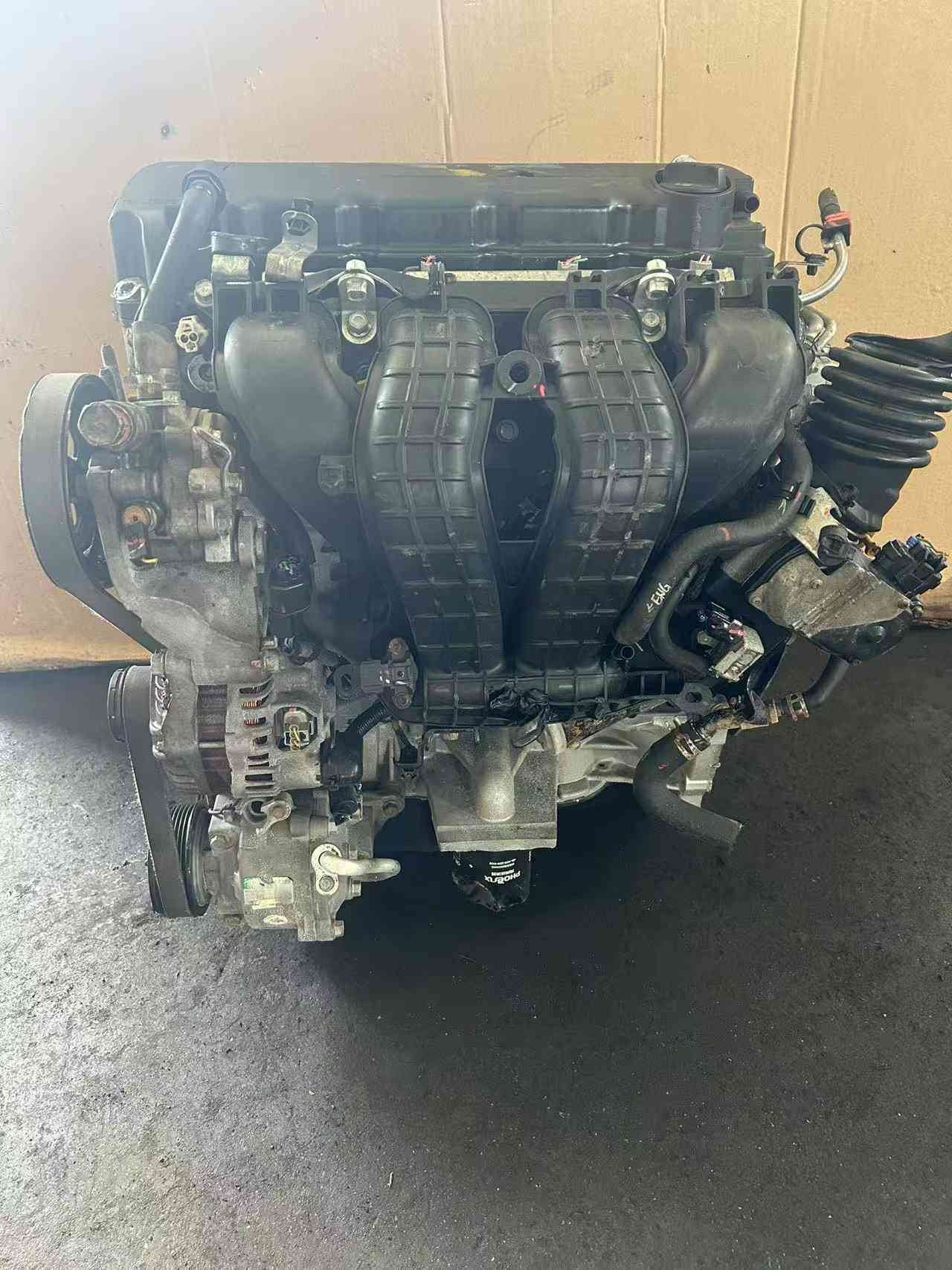 Front view of a genuine Mitsubishi 4B10 replacement engine with low mileage.