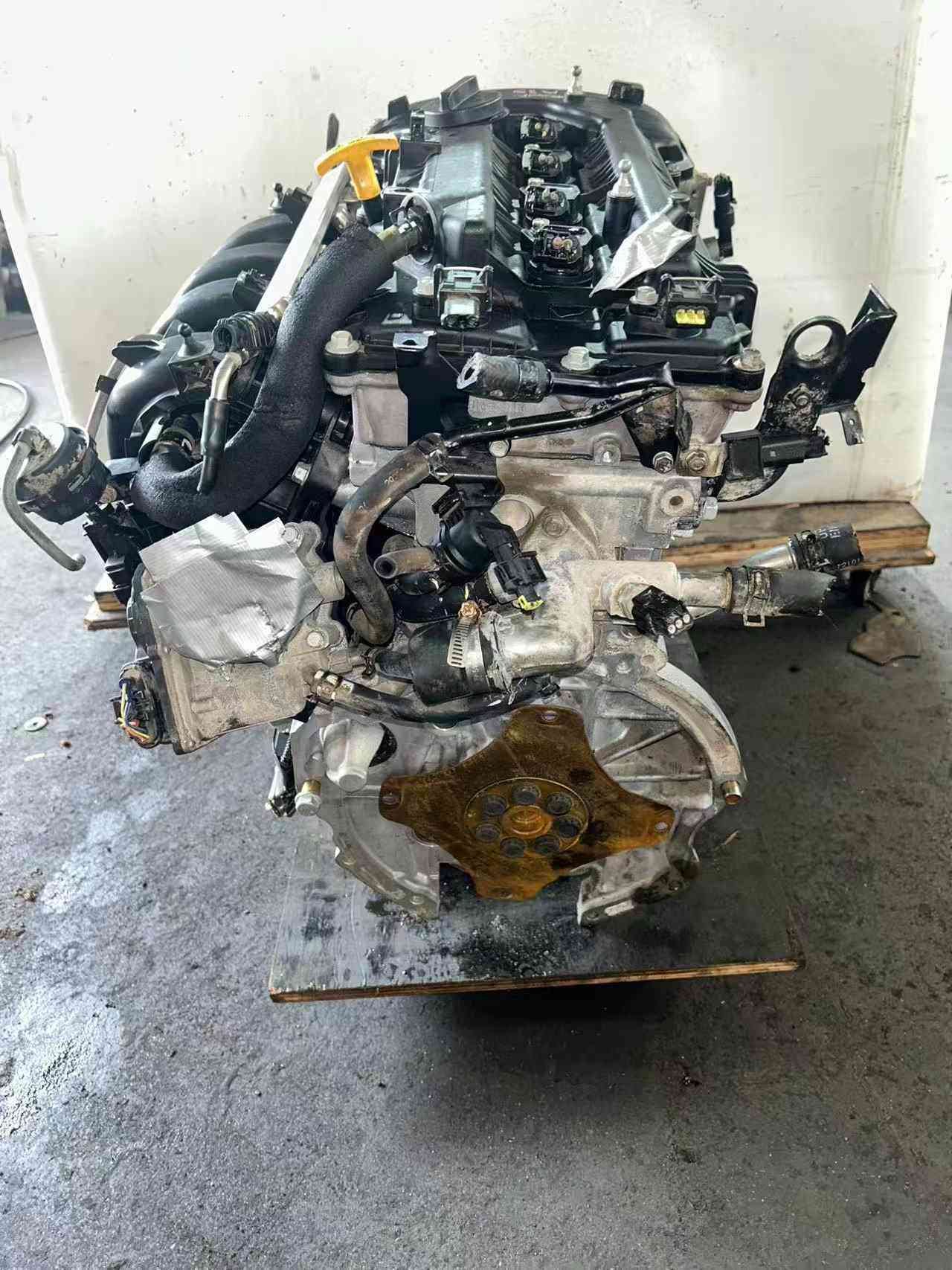 Genuine used Hyundai Elantra 1.8L Nu engine (G4NB) harness and hose side view for sale - wrapped parts and engine piping