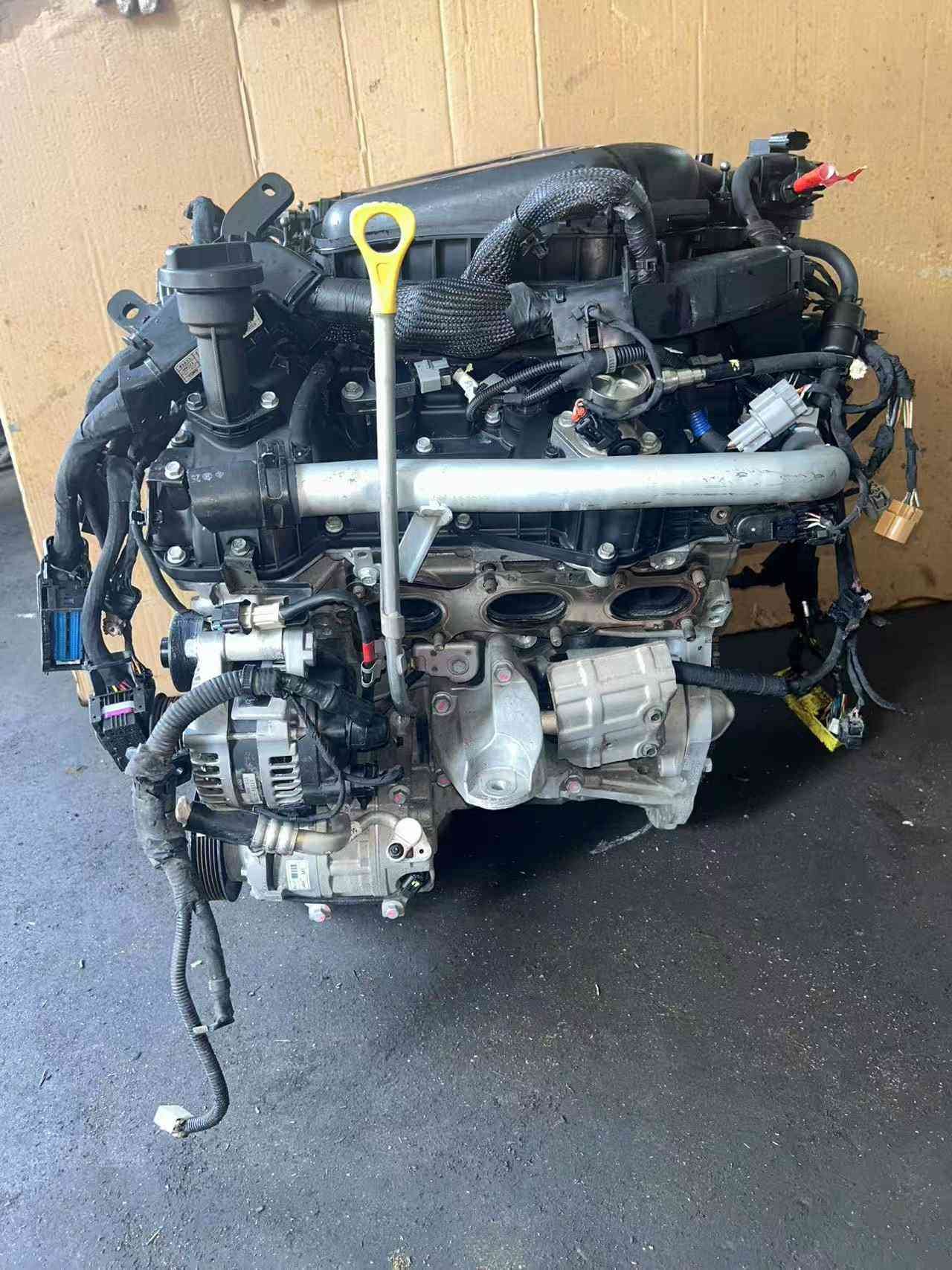 Genuine used Hyundai Genesis 3.3L GDI V6 engine (G6DH) dipstick side view for sale - oil dipstick and cooling hoses