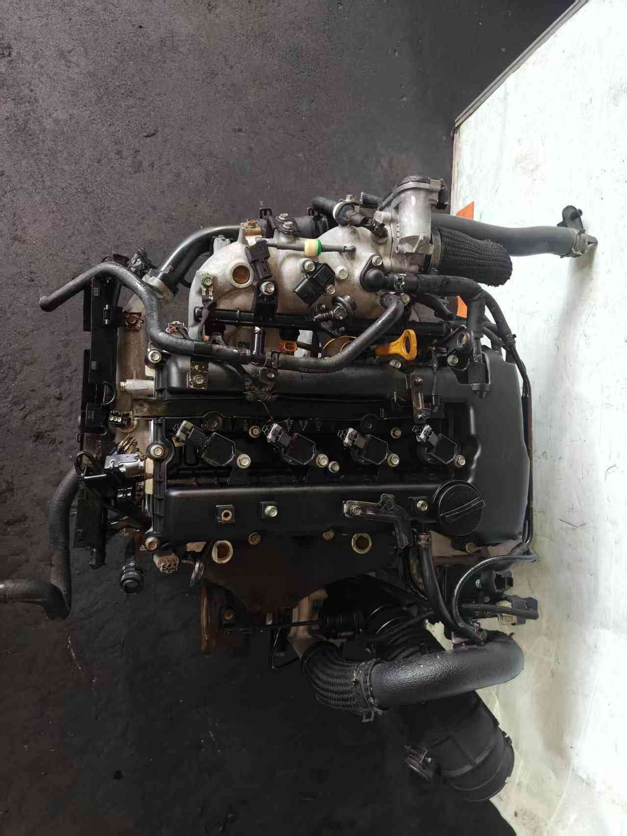 Genuine used Hyundai Genesis Coupe 2.0L Theta II turbocharged engine (G4KF) front view for sale - turbo piping, dipstick and ignition coils