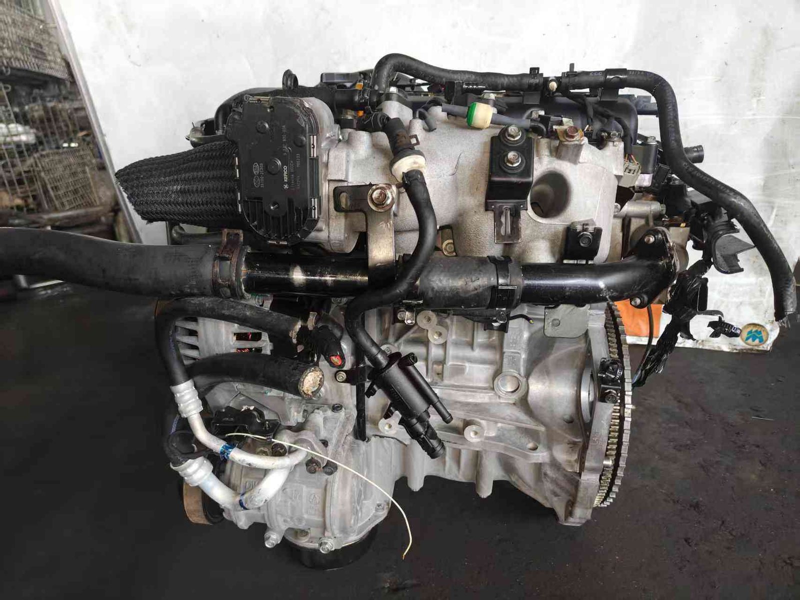 Genuine used Hyundai Genesis Coupe 2.0L turbo engine (G4KF) labelled side view for sale - KIA tag 35100-04200 and ring gear end