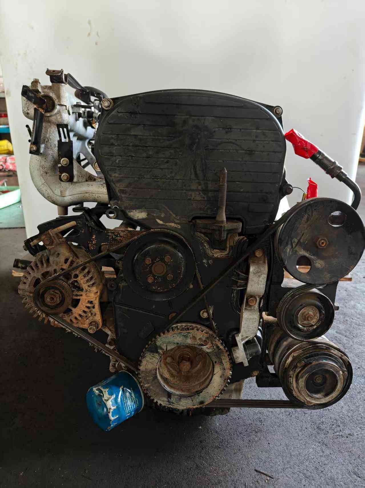Genuine used Hyundai Sonata 2.0L Sirius II engine (G4JP) timing belt side view for sale - timing cover, pulleys and alternator