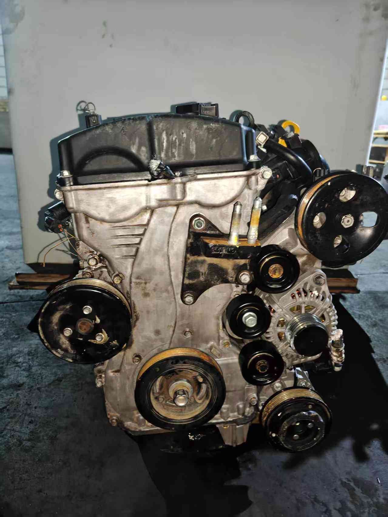 Genuine used Hyundai Sonata 2.4L Theta II engine (G4KE) spark plug and belt pulley side view for sale - pulleys, plug wiring and accessories