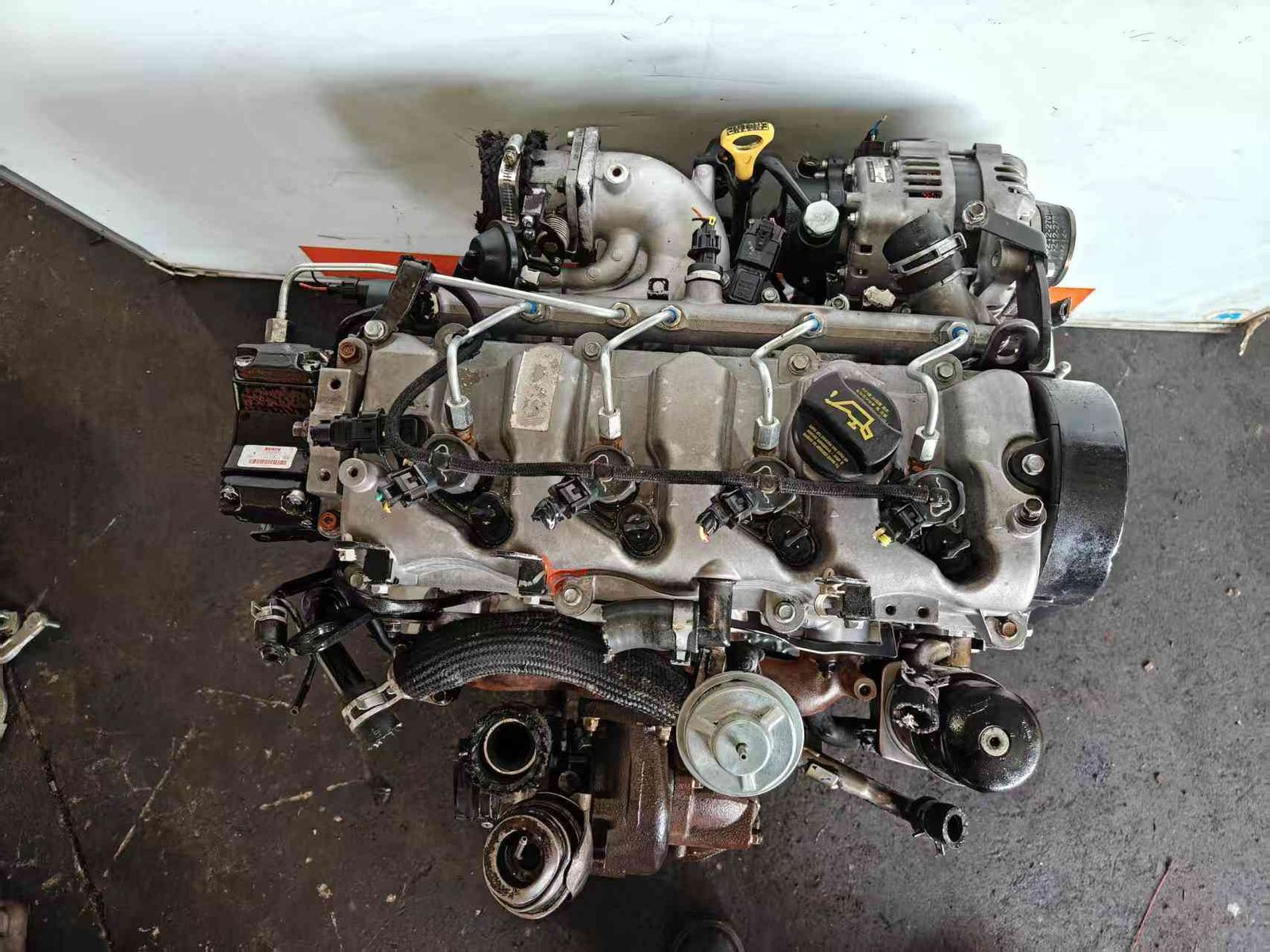 Genuine used Hyundai Tucson 2.0L CRDi diesel engine (D4EA) turbocharger and sensor close-up for sale - dipstick, turbo and wiring sensors