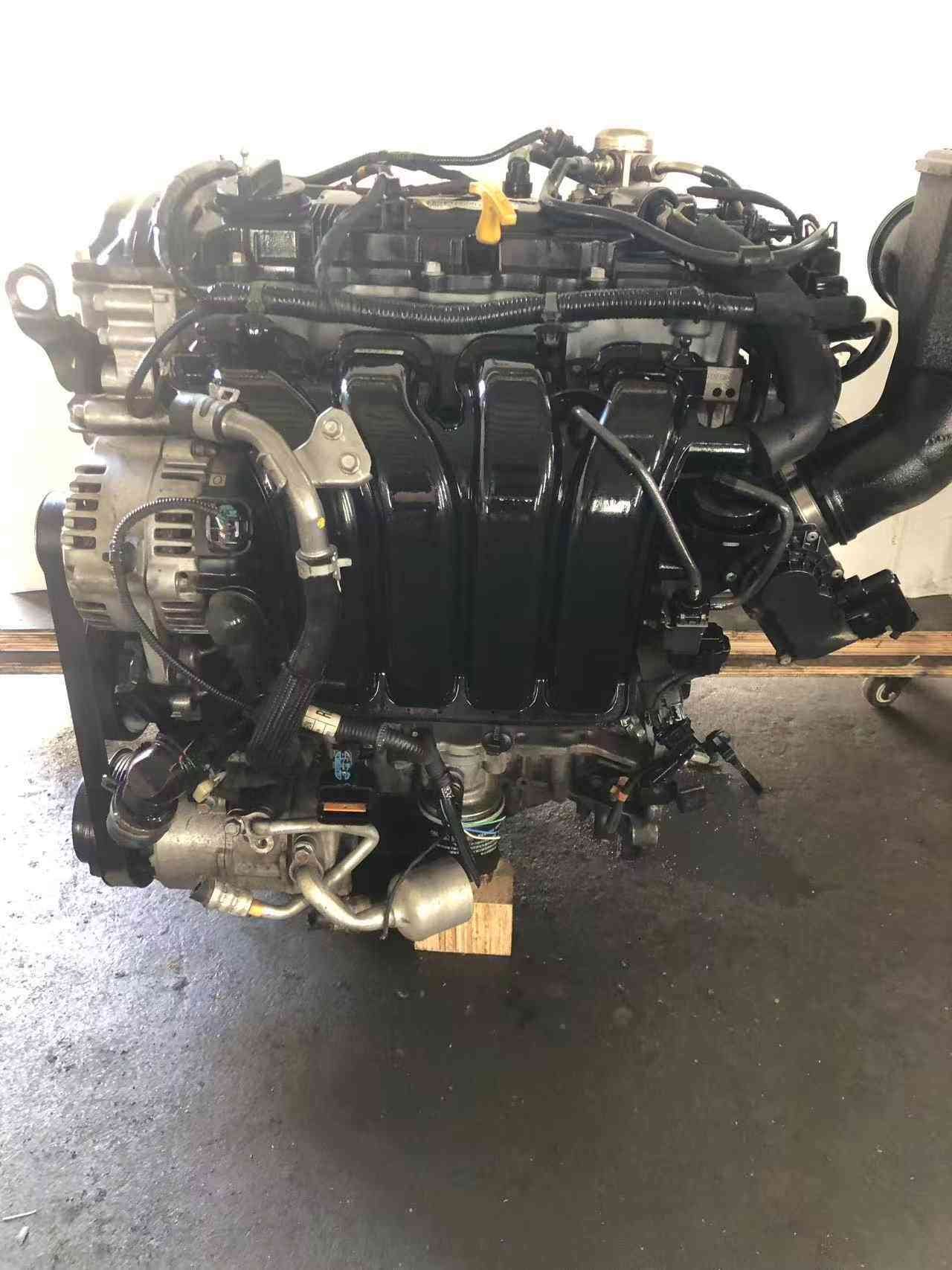 Genuine used Hyundai Tucson 2.0L Nu GDI engine (G4NC) intake manifold side view for sale - alternator and dipstick