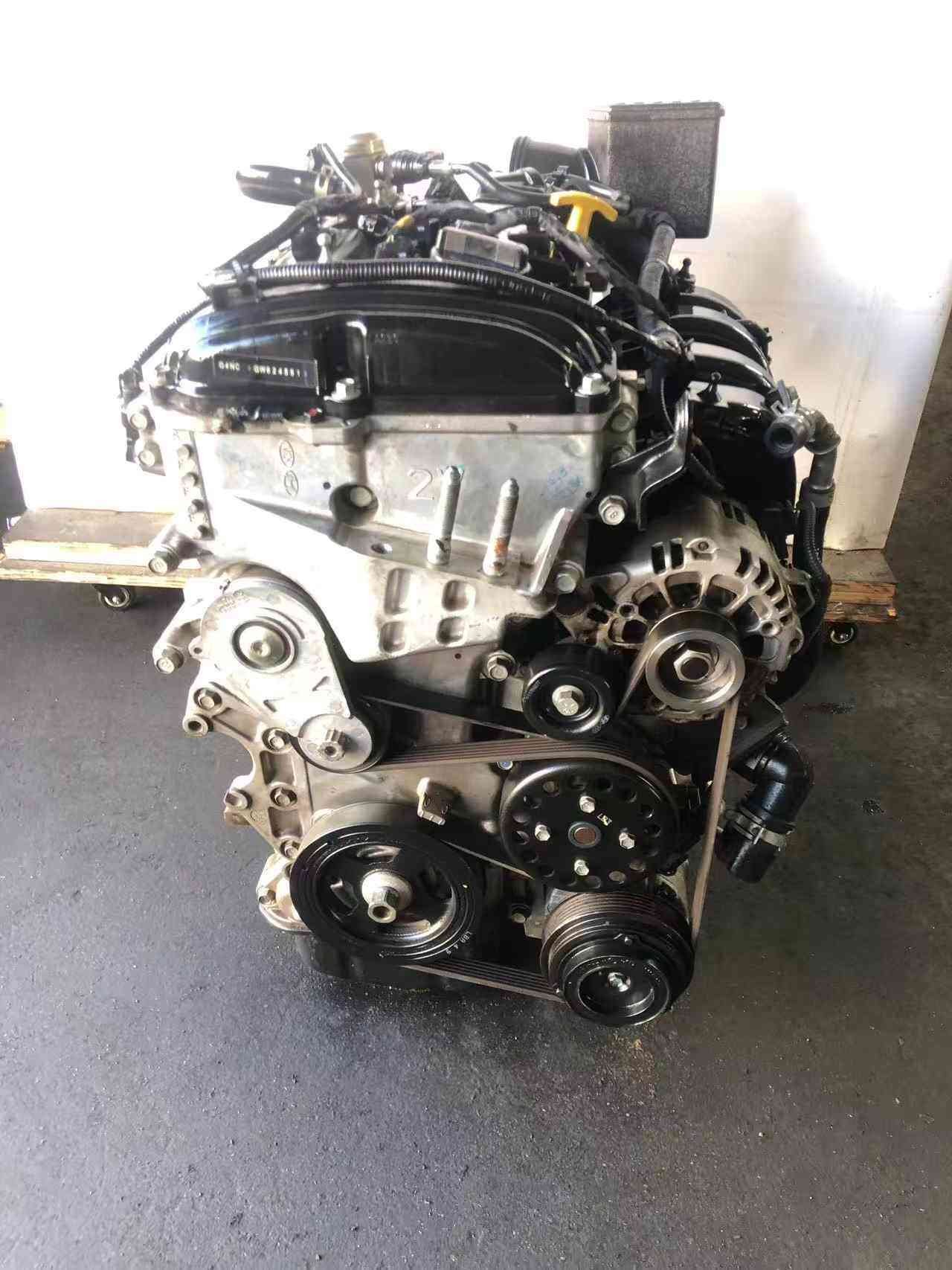 Genuine used Hyundai Tucson 2.0L Nu GDI engine (G4NC) timing side view for sale - pulleys and block stamping