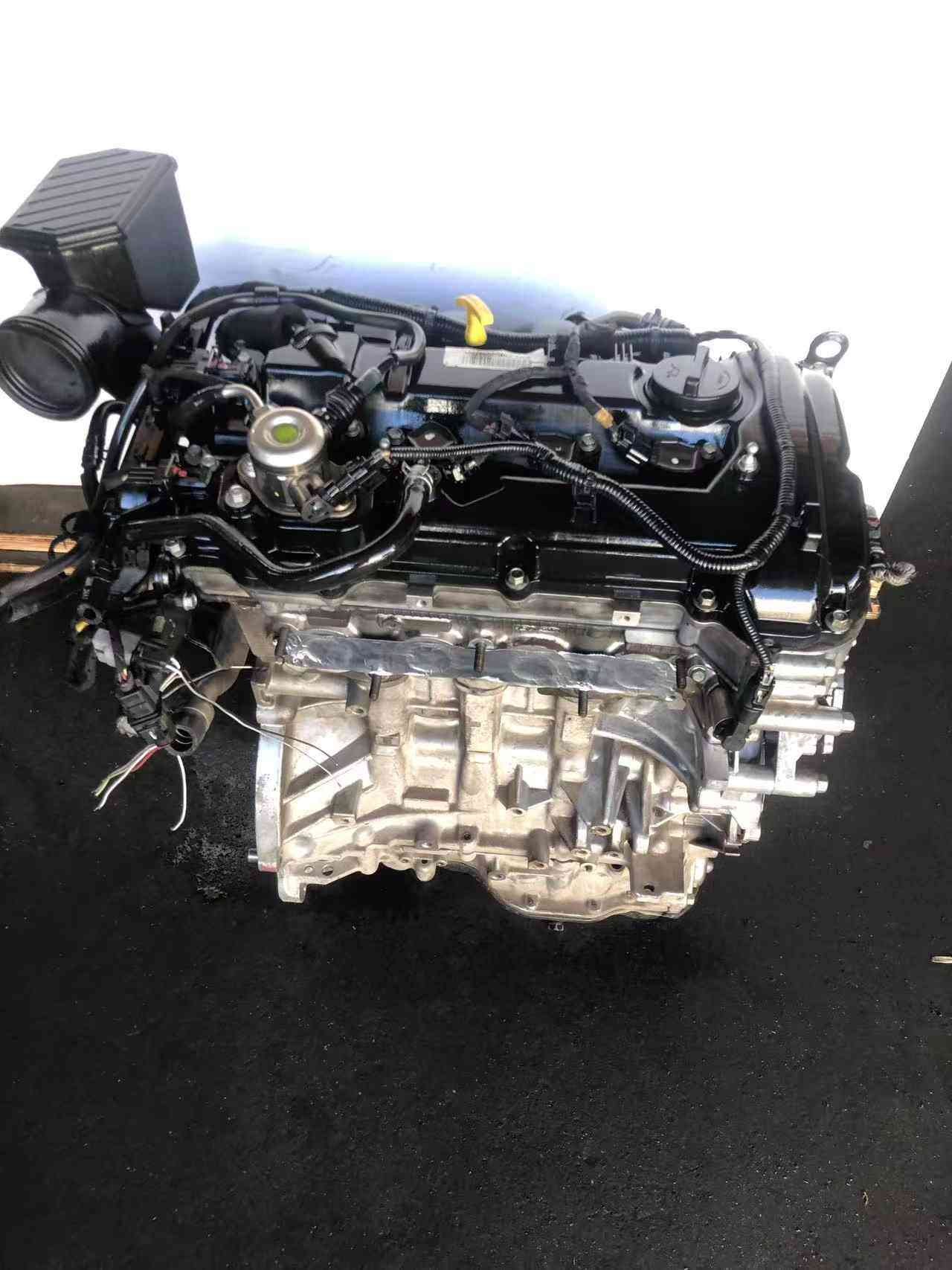 Genuine used Hyundai Tucson 2.0L Nu GDI engine (G4NC) valve cover and sensor side view for sale - clean block and sensors