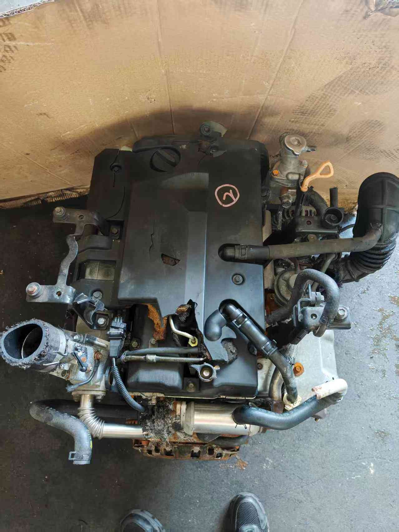 Genuine used Kia Carnival 2.9L turbo diesel engine (J3) block side view for sale - orange dipstick and as-is used condition