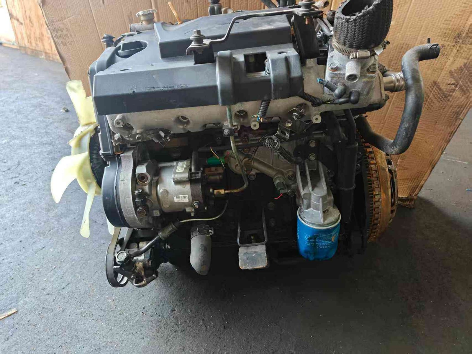 Genuine used Kia Carnival 2.9L turbo diesel engine complete assembly (J3) front view for sale - radiator fan and oil filter