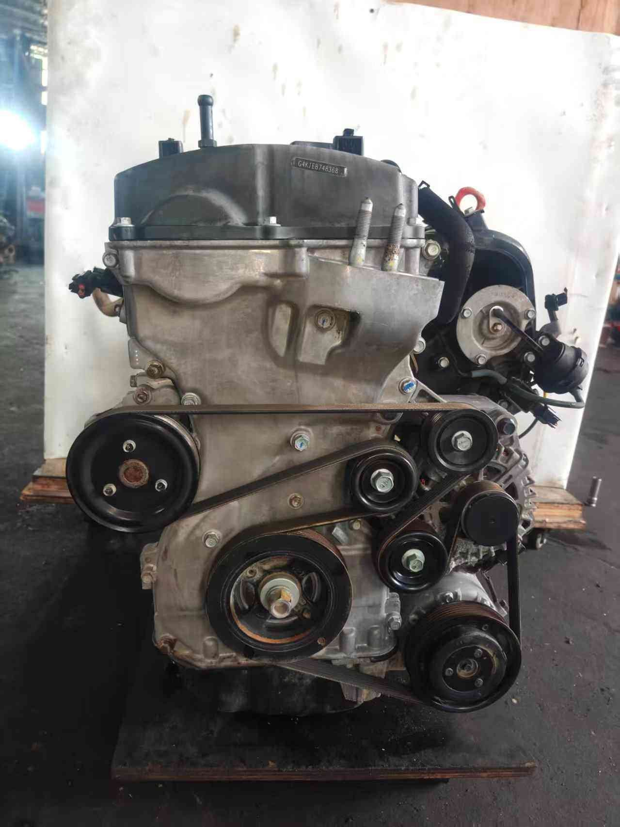 Genuine used Kia Optima 2.4L GDI engine (G4KJ) serial stamping side view for sale - G4KJ stamped block and belt pulleys