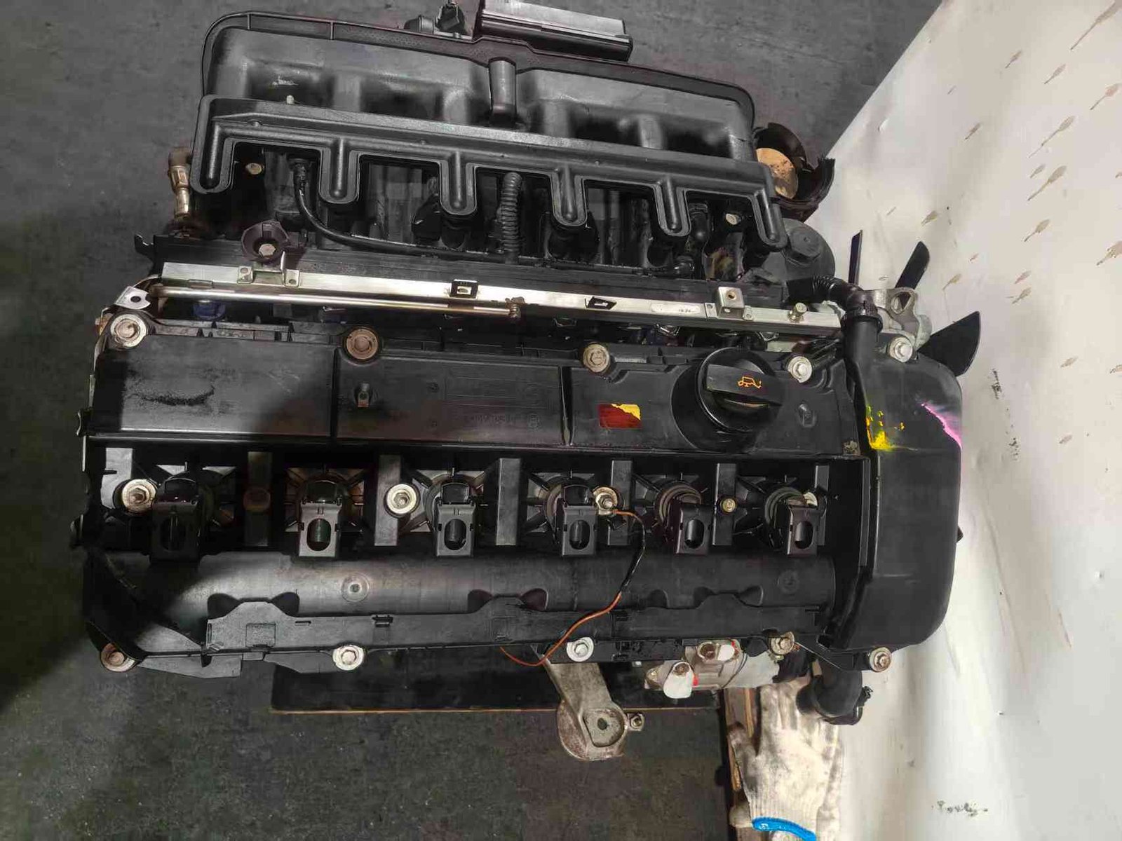 BMW M54B25 complete used engine assembly showing the intake manifold and valve cover