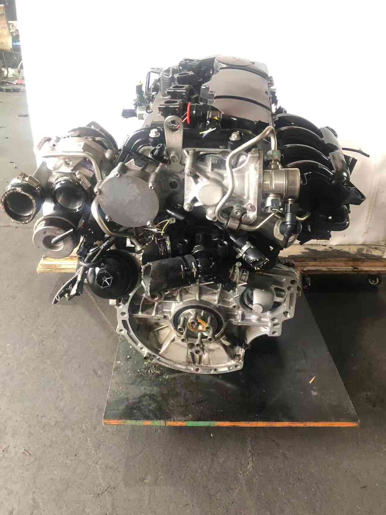 BMW N18B16A complete used engine assembly with intake components and turbocharger visible