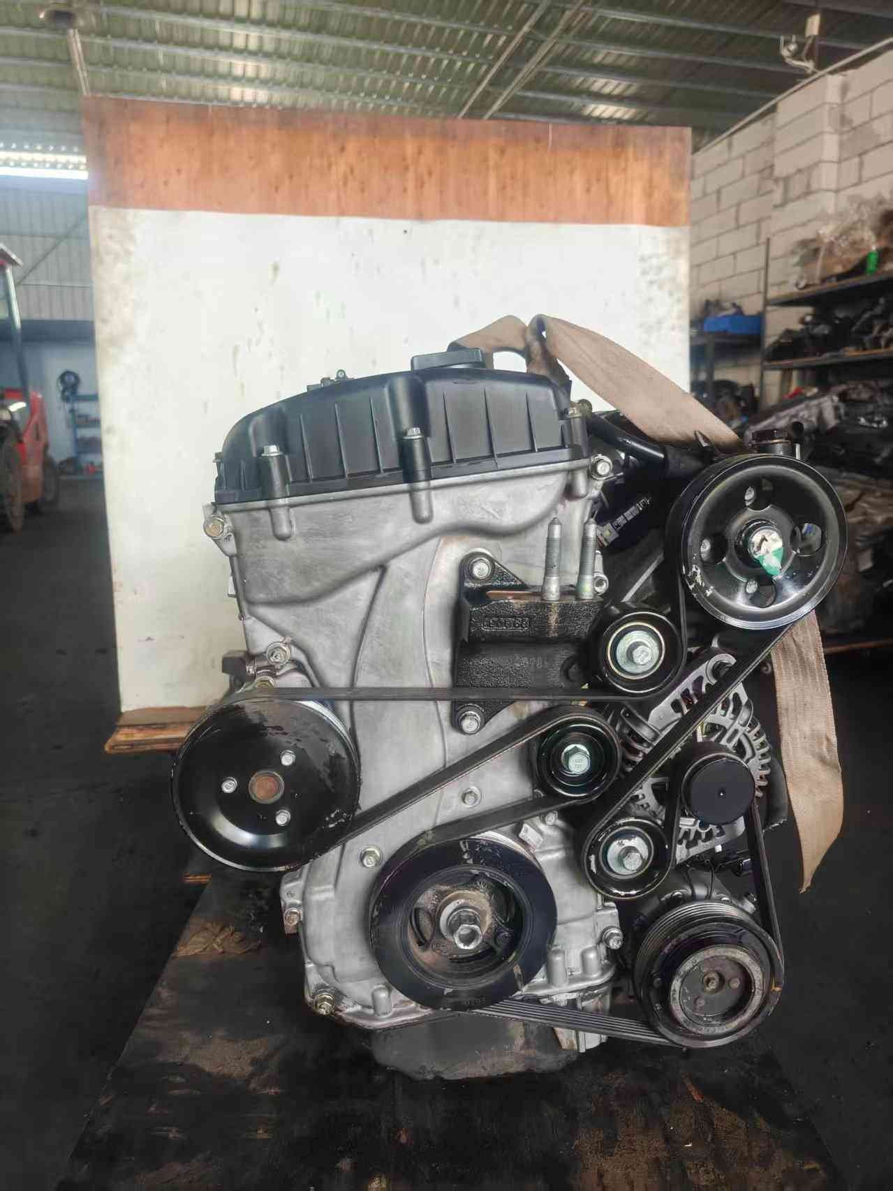 Hyundai Kia G4KC used engine front view with serpentine belt, pulleys and alternator