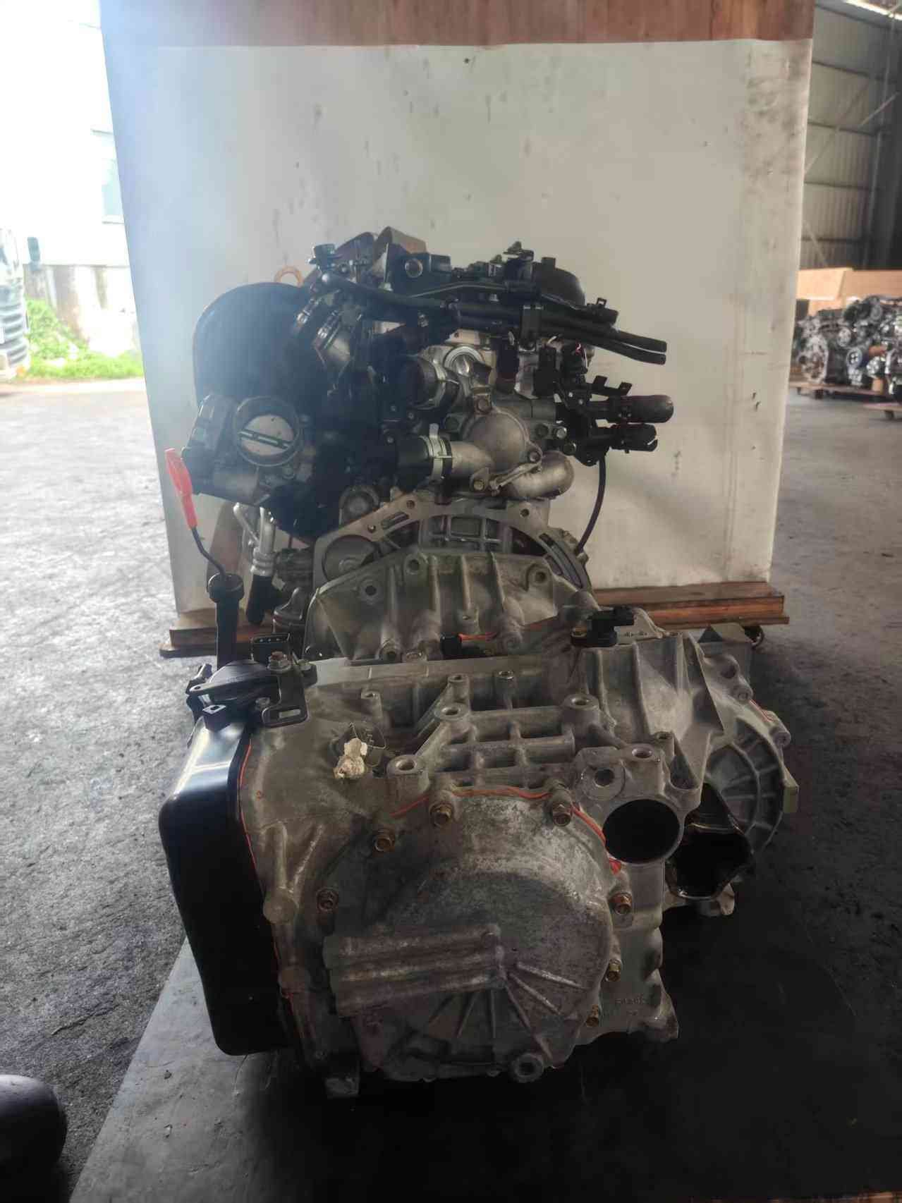Hyundai Kia G4KC used engine transmission end view with gearbox housing and intake components