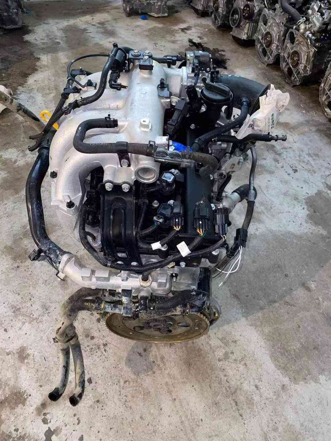 Hyundai Kia G4KG used engine top view showing intake system, wiring connectors and hoses