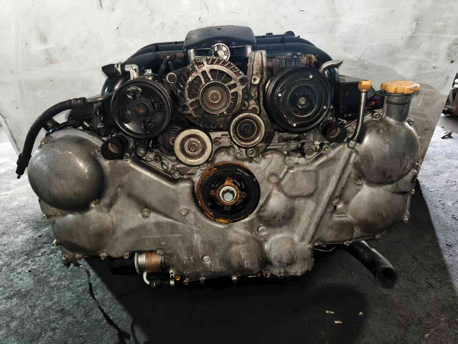 Subaru EZ30 engine assembly front view with alternator, accessory pulleys and engine covers