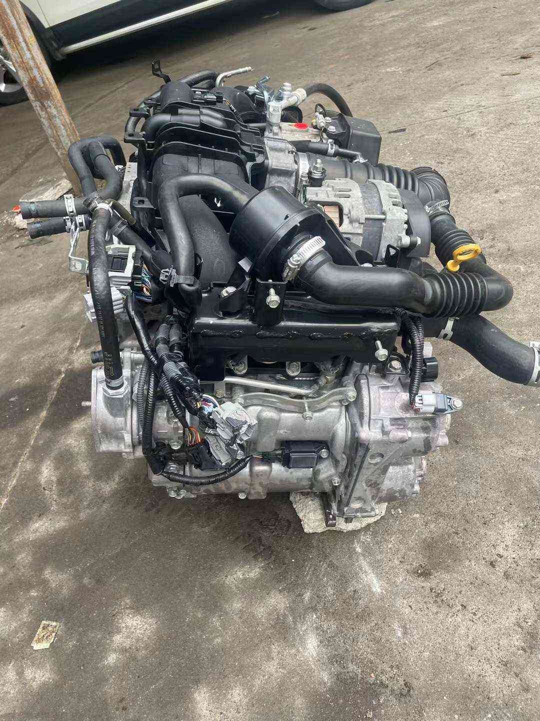 Subaru FA20 naturally aspirated engine assembly with intake tubing, alternator and wiring harness