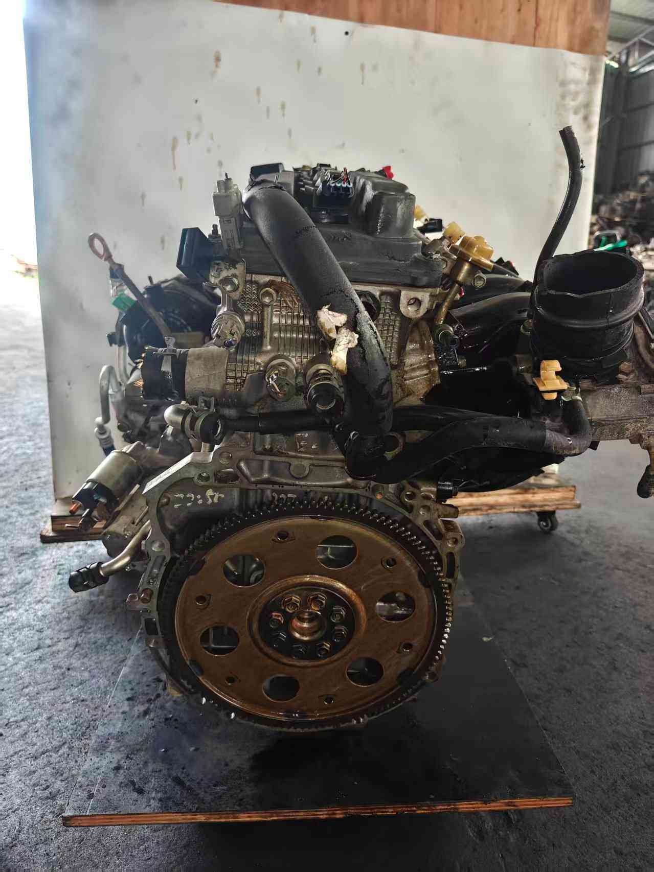 Toyota 1AZ used engine rear view with exposed flywheel