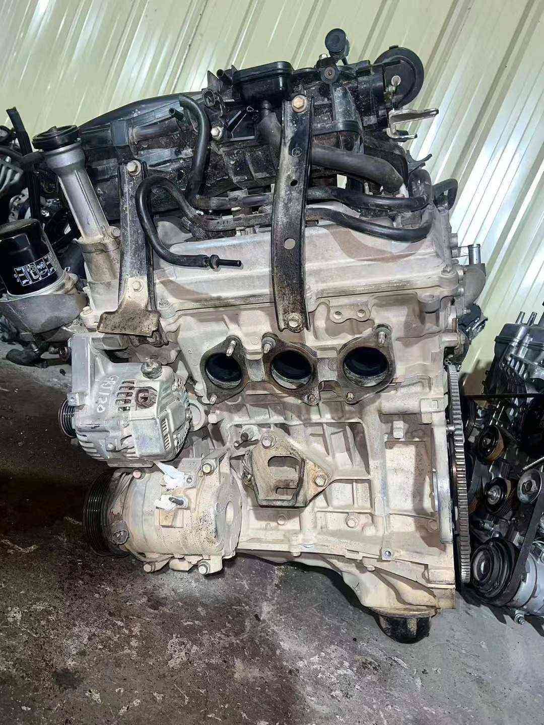 Toyota 1GR engine side view with alternator and exposed intake ports