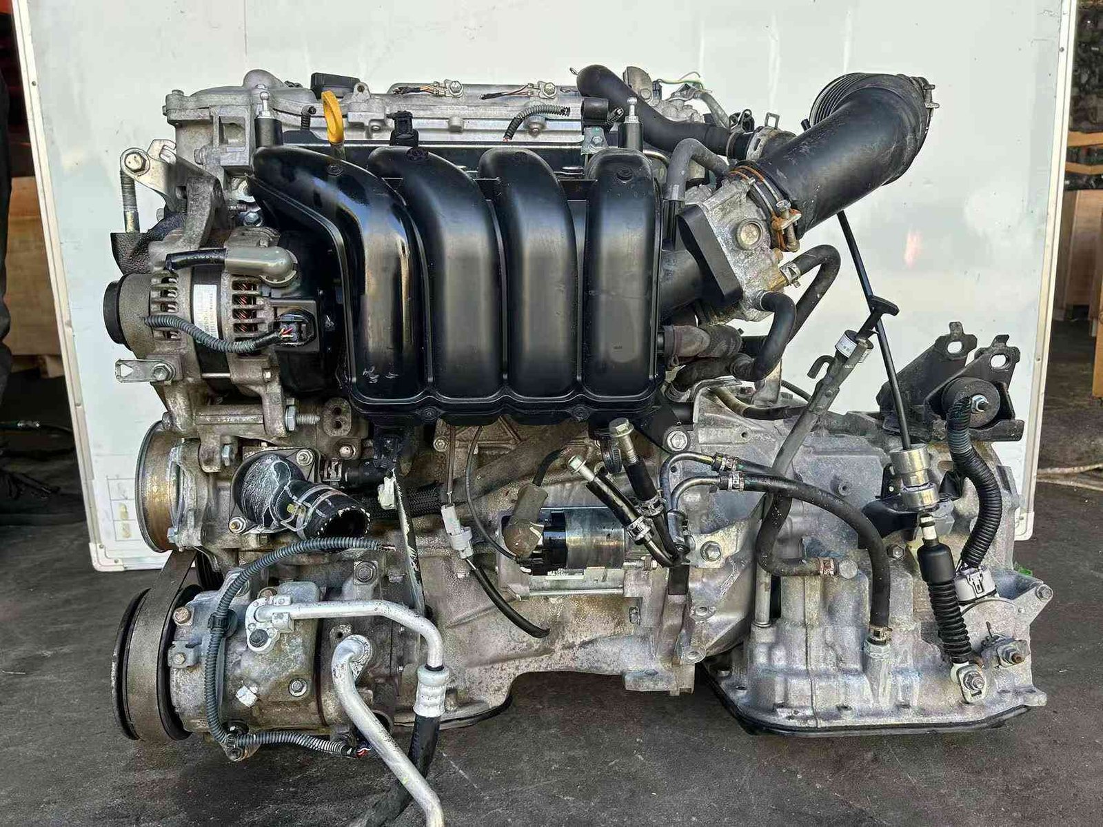 Toyota 1ZR engine exhaust side with heat shield and transmission