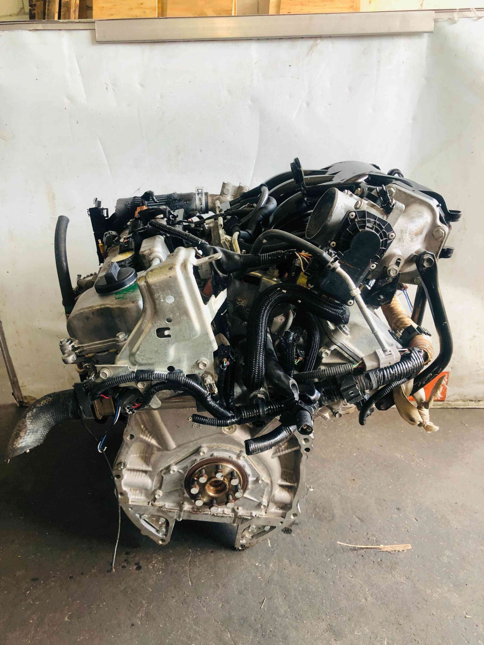 Toyota 3MZ-FE engine rear view with flywheel and wiring harness