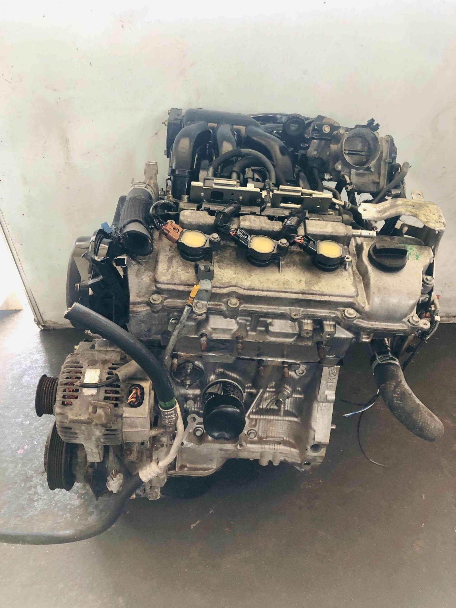 Toyota 3MZ-FE engine front view with alternator, oil filter and intake manifold