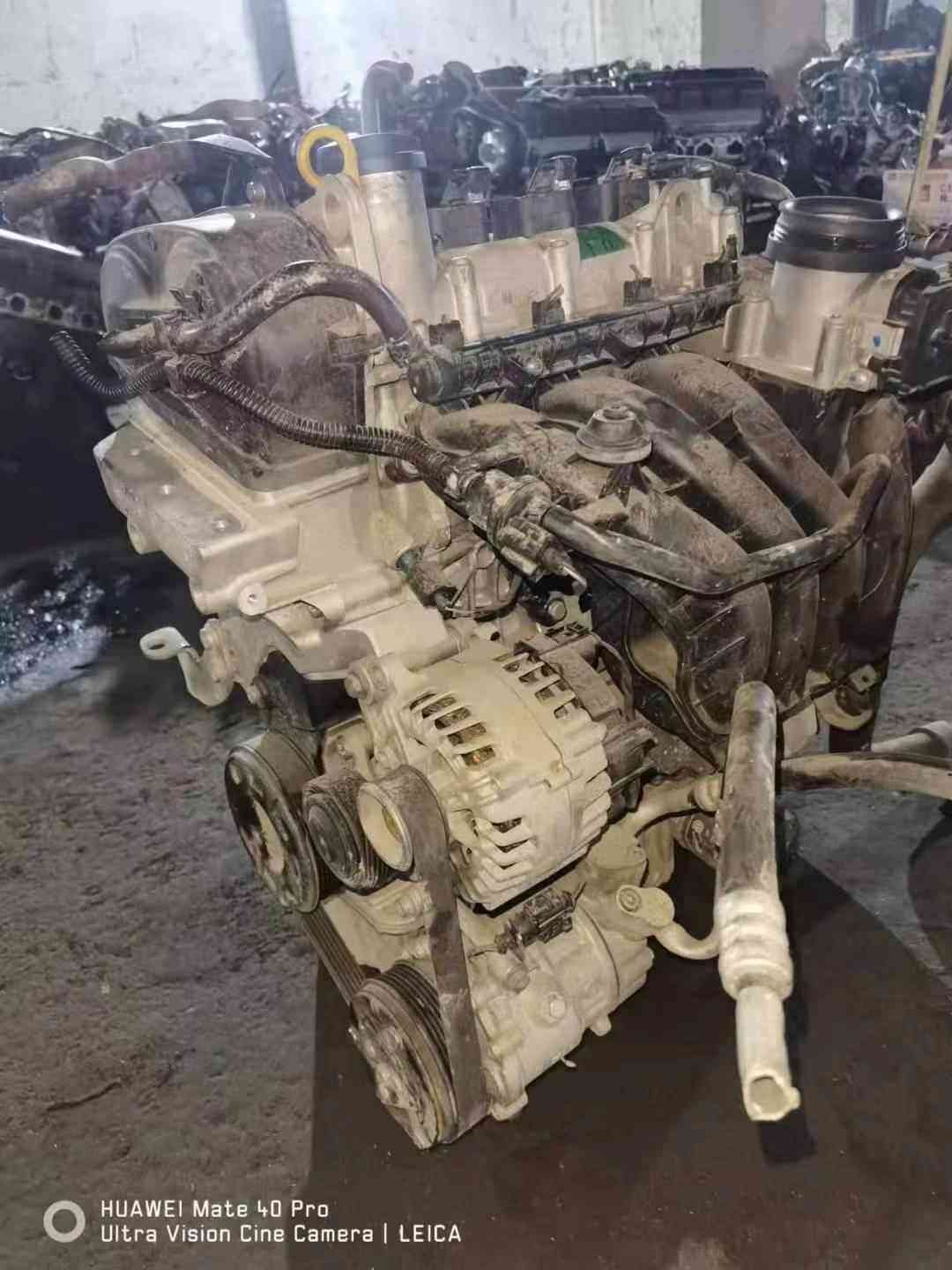 Volkswagen EA211 CKA engine viewed from the front with alternator, accessory pulleys, and intake manifold.